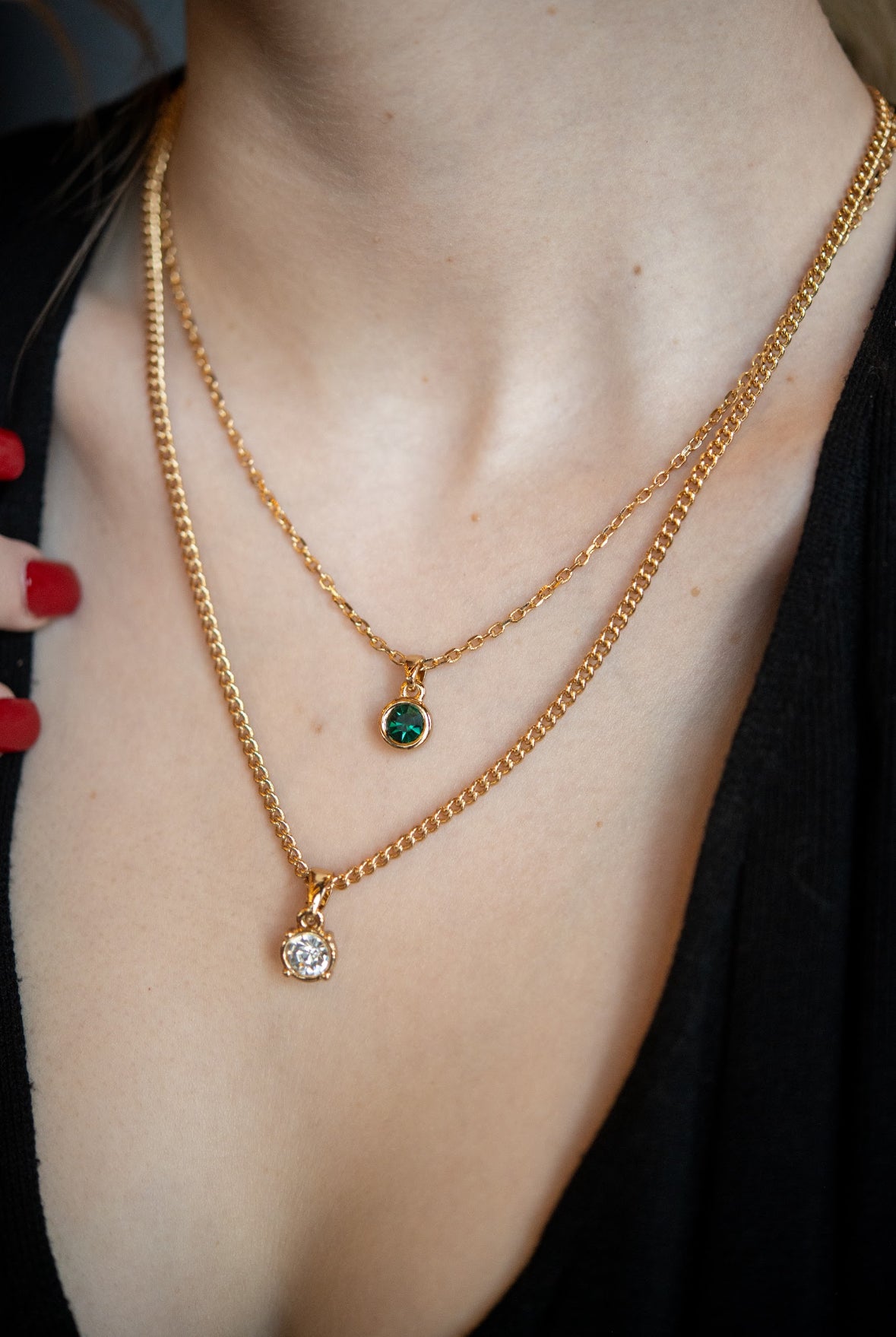 Green crystal gold necklace
Dainty pendant necklace for layering
Close-up of green gemstone necklace