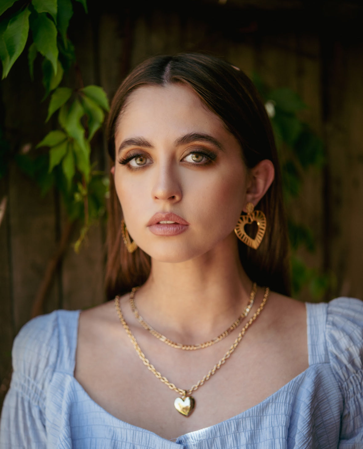 Model wearing bold gold heart earrings
Striped texture gold heart statement earrings
Lightweight heart earrings for bold looks