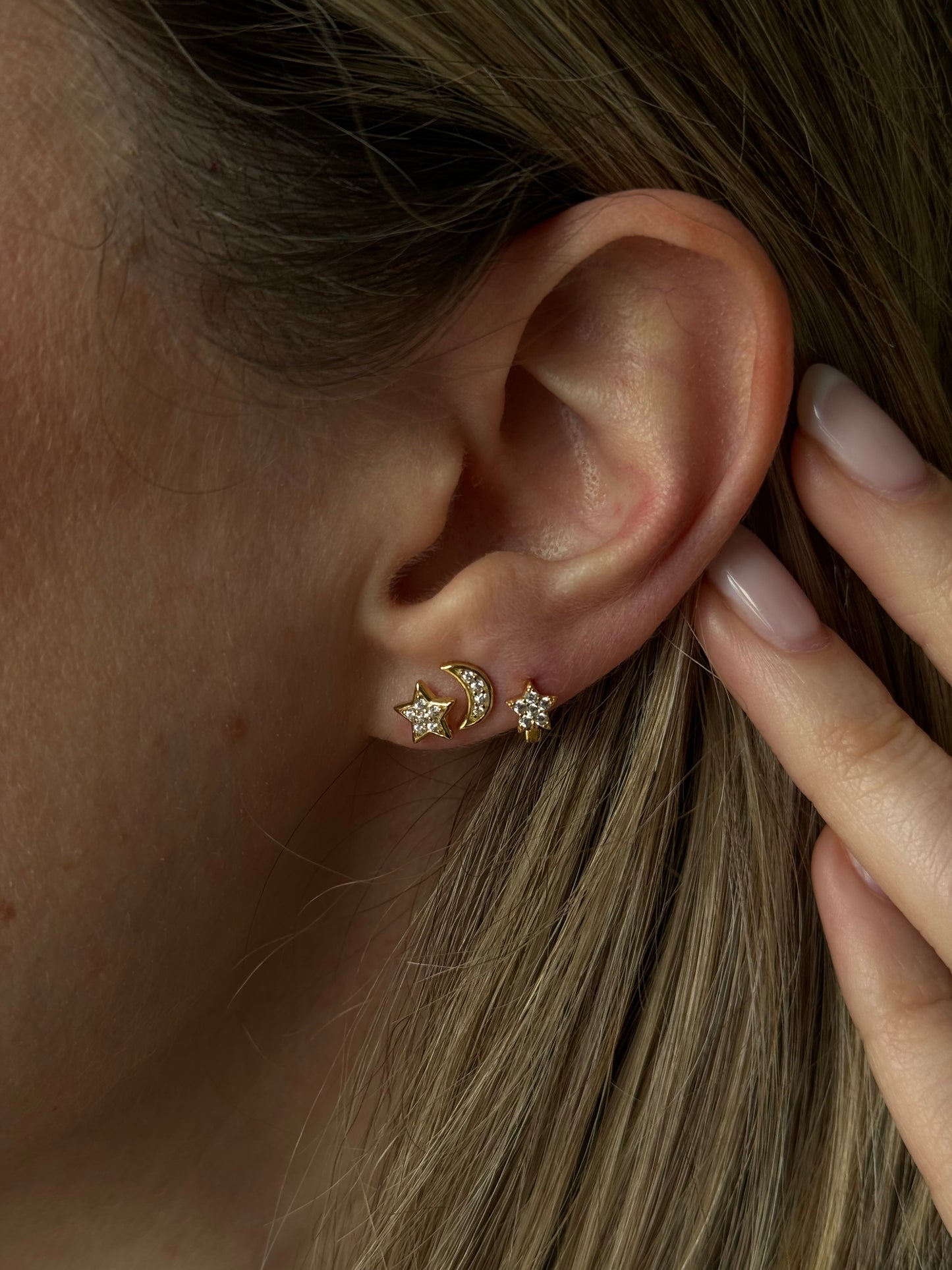 These stunning earrings feature intricate star and moon designs, crafted with expert precision. Made from high-quality materials, they are not just stylish but also durable.
Perfect for everyday wear.
Unleash the power of your YOUniverse… and look HOT doing it.
Material: 925 Sterling Silver + gold plated 18K
Measurements: star: .25 in moon .27 x .17 in