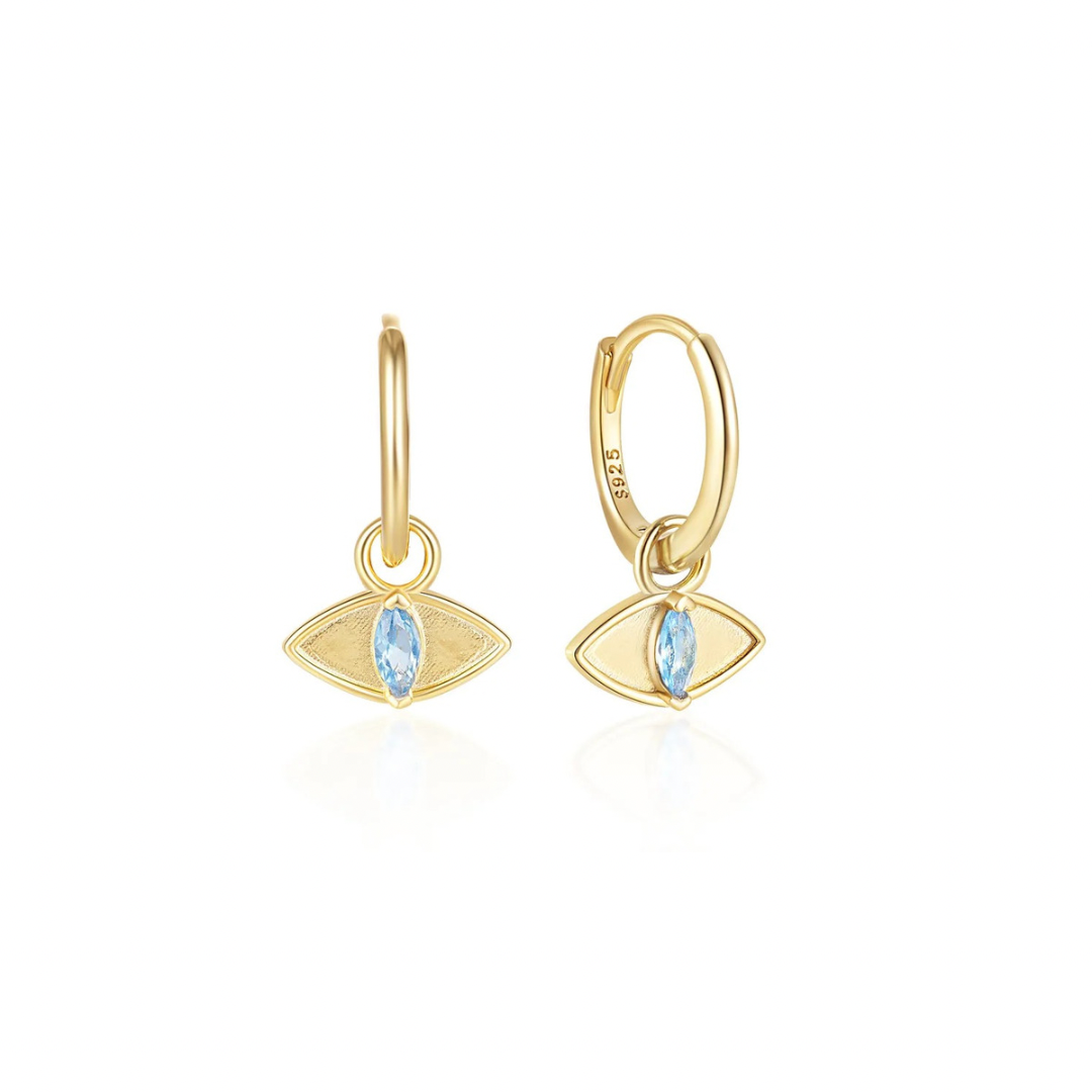 Keep the bad vibes away with our EVIL EYE DIAMOND BLUE HOOPS.
These eye-catching hoops feature a dazzling blue diamond in the center, surrounded by a chain of evil eye symbols.A playful way to accessorize while protecting yourself from negativity.
Protective style, striking design, good vibes only!
Material: .925 Sterling Silver + 14K gold plated
Measurements: .70 x .40 in
