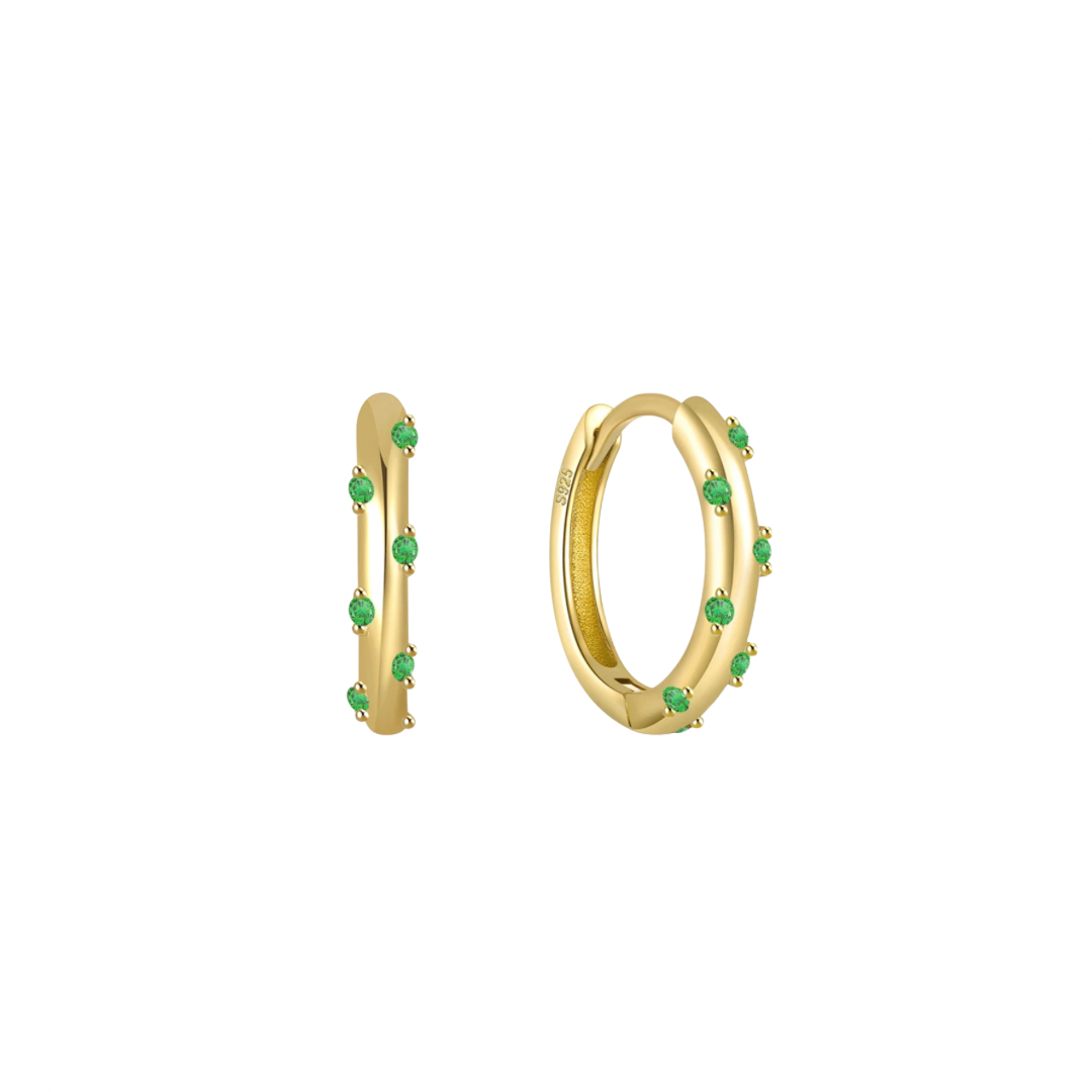 Add a splash of color to your daily routine with our Green Yoli Hoops! These playful hoops are sure to brighten up any outfit and put a smile on your face.
The combination of the gold color and the green stone creates a harmonious and eye-catching piece, suitable for both casual and more formal occasions.
Material: .925 Sterling Silver + 18K gold plated
Measurements: .55 in diameter