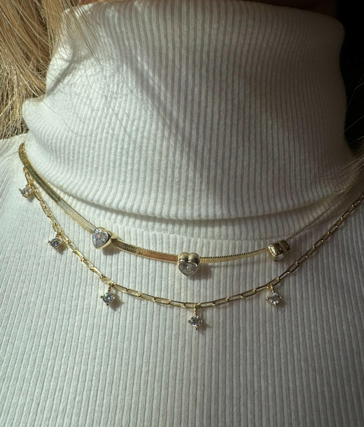 Add some spark to your outfit with the Figaro Spark Necklace. This unique necklace brings a touch of fun to any look. 
Get ready to turn heads and make a statement with this playful accessory.
Warning: may cause excessive compliments
Material: Sterling silver .925 + 18K gold plated
Measurements: 15 in + 2 in pendants: .15 in