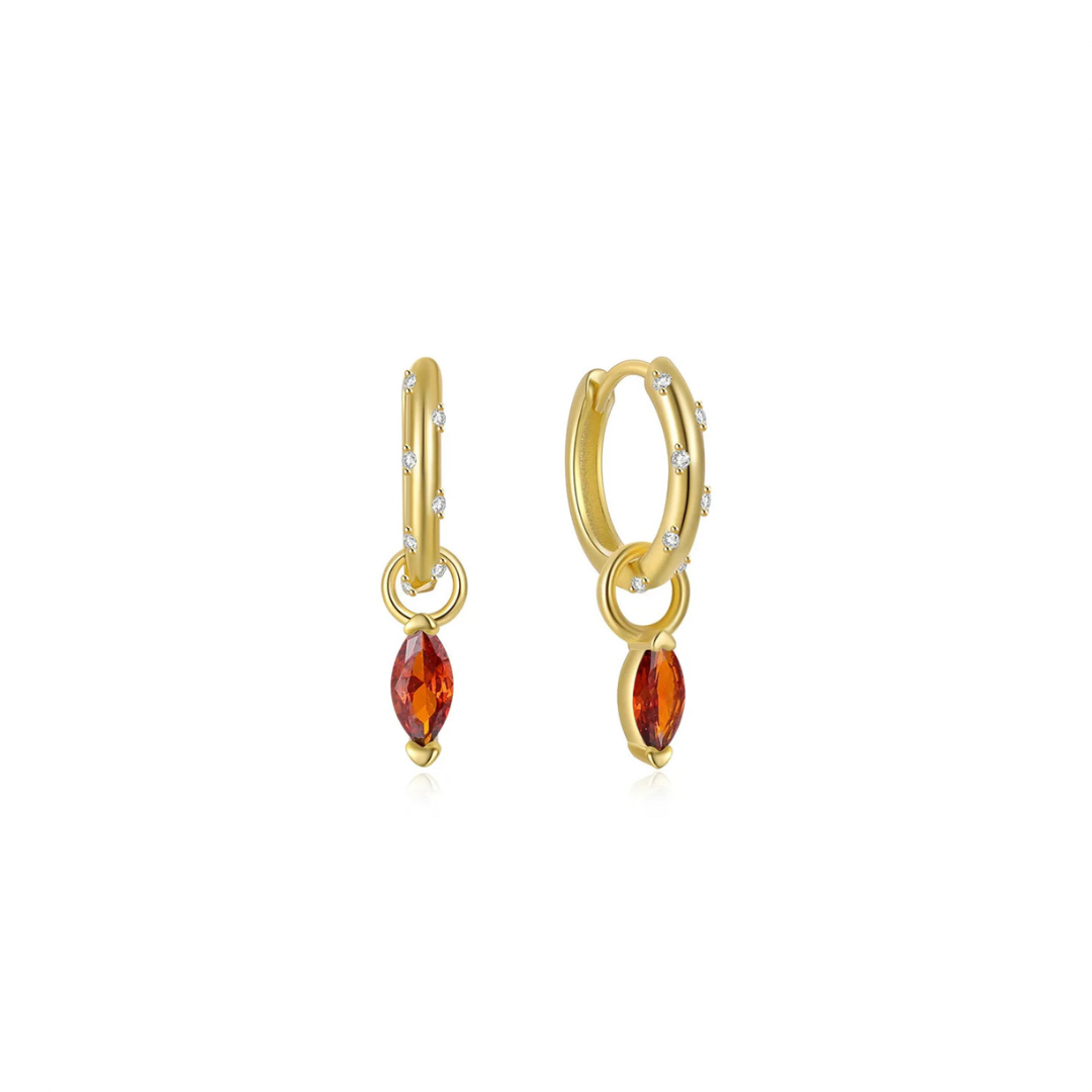 These SPARKLE OVAL RED CHARM HOOPS add a touch of elegance and sophistication to any outfit. The sparkling red charm design adds a pop of color and the oval shape creates a flattering silhouette. Made with high-quality materials for long-lasting wear. Elevate your style with these stunning hoops.
Material: .925 Sterling Silver + 14K gold plated
Measurements: .50 in x .50 in
pendant: .25 in x .25 in