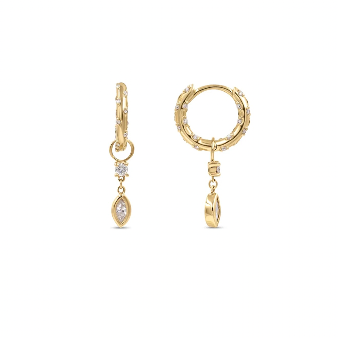 Add a touch of whimsy to your look with these CLEAR YOLI DROP HOOPS. The clear hoops create a fun and playful vibe, perfect for any event. Elevate your style with these quirky hoops.
Material: .925 Sterling Silver + 18K gold plated
Measurements: 1.10 x .57 in