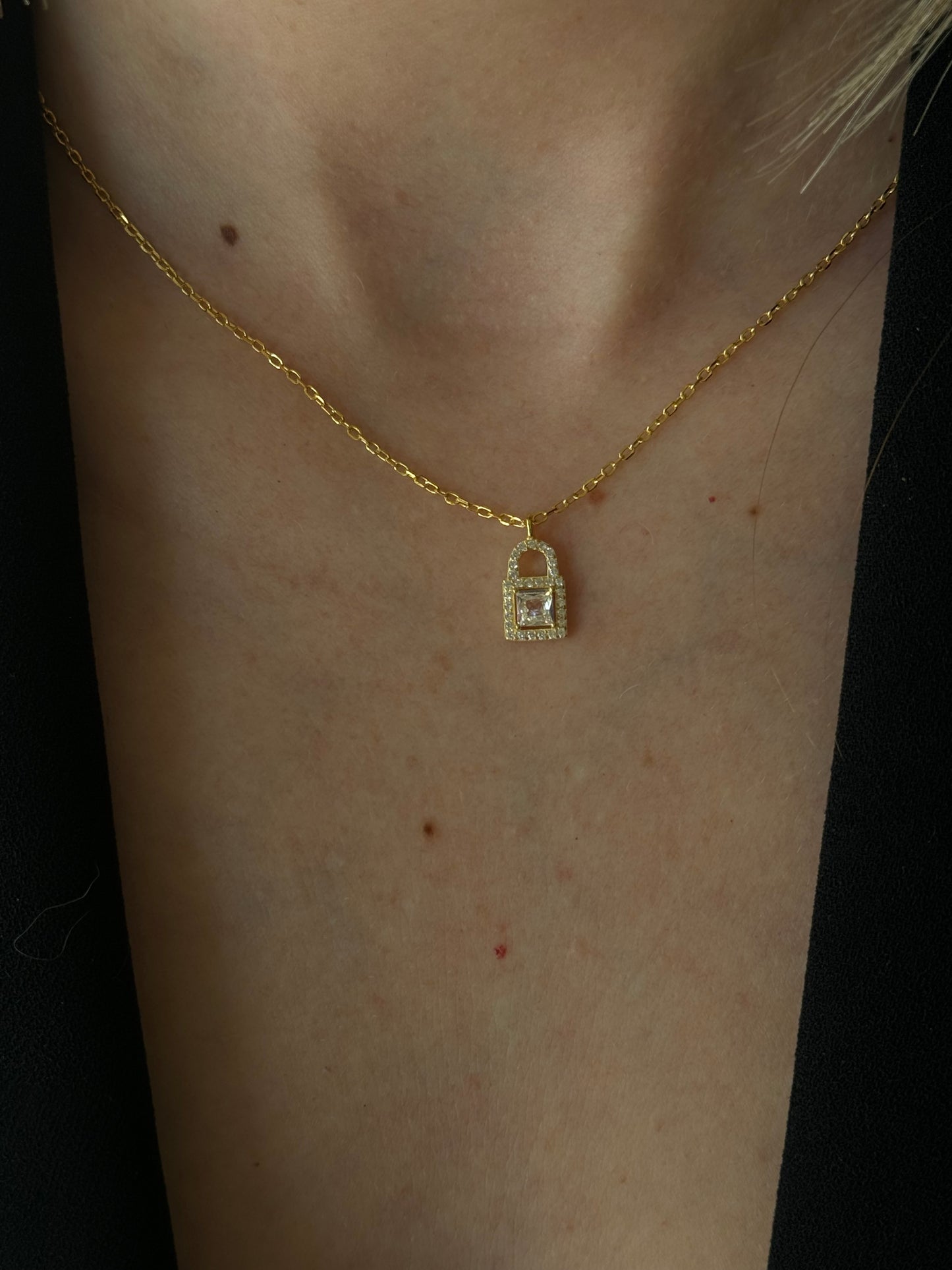 Unlock your style with this LOCK NECKLACE. Made with 925 Sterling Silver + gold plated 18K it's perfect for everyday wear. Keep your look secure and on trend with this stylish accessory!
This necklace features a delicate lock charm that symbolizes your unbreakable bond. Show your love with this meaningful and timeless gift.
Material: 925 Sterling Silver + gold plated 18K
Measurement: 15.90 in + 2.0 in pendant: .50 in