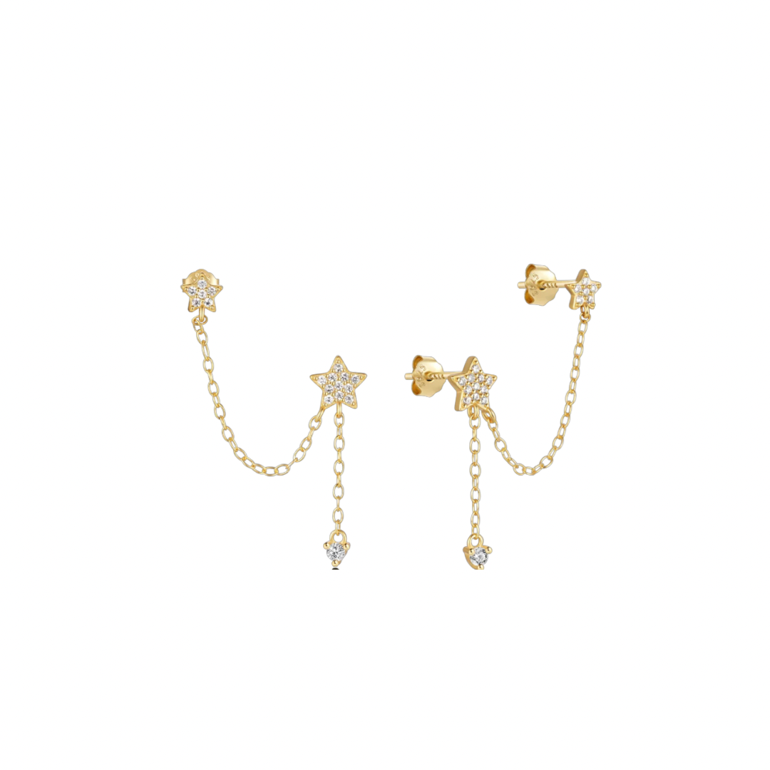 Unleash your rebellious side with the STAR CHAIN DOUBLE STUDS. These edgy earrings feature a unique double chain design with a bold star hanging from each stud. Dare to be different and add a touch of daring to your everyday look.
Unleash the power of your YOUniverse… and look HOT doing it.
Material: 925 Sterling Silver + gold plated 18K
big star: .25 in
Chain length between stars: 1.10 in