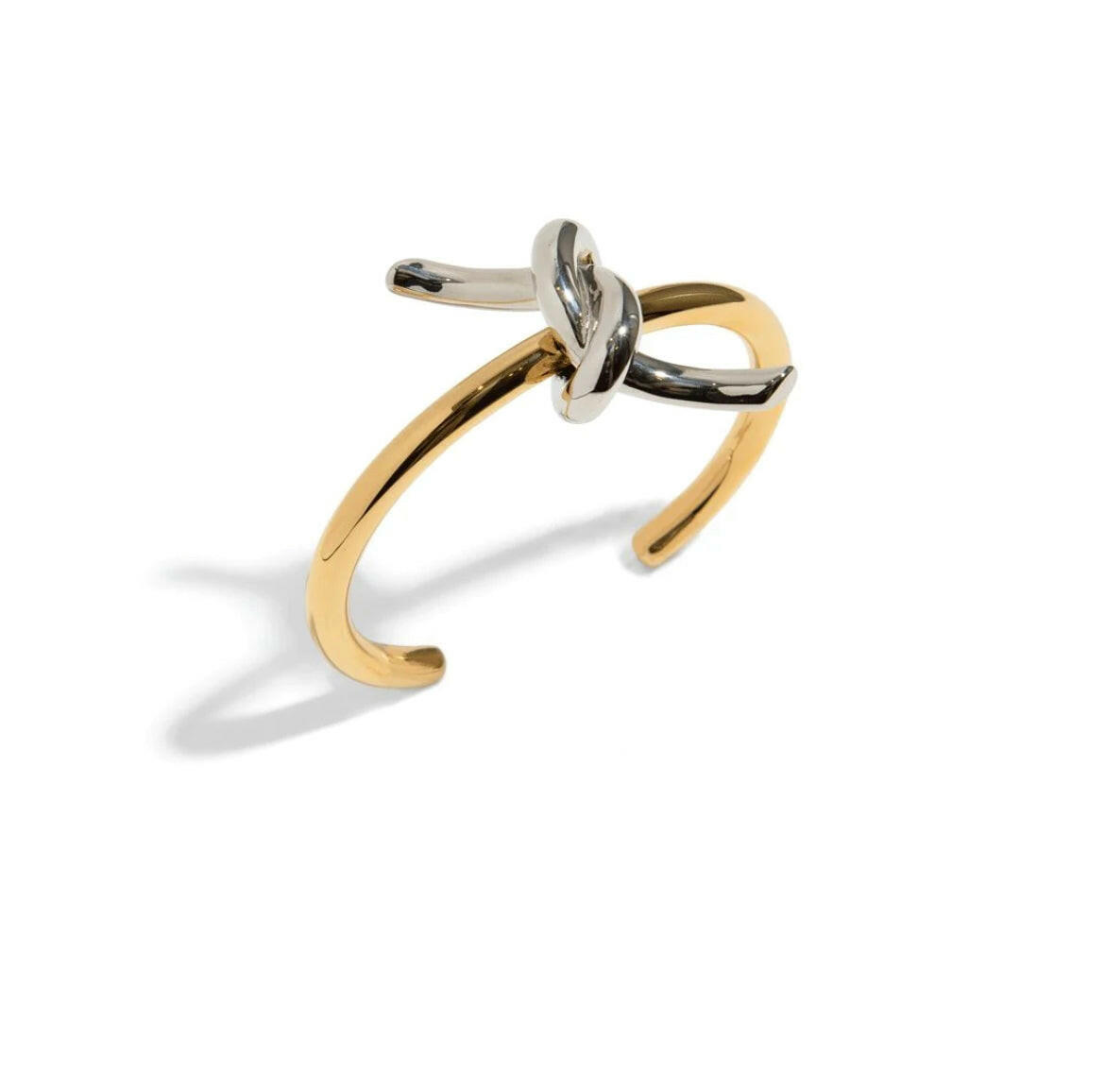 Elevate your style with our SOULMATE BRACELET. This cuff bracelet features a symbolic knot design. With its elegant and timeless appeal, it will effortlessly complement any outfit, making it an essential piece for every fashion-forward individual.
Elevate your look and embody the bond of true love with our SOULMATE BRACELET.
Material: 100% BRASS and 18K gold plated
Measurements: 2.40 x 2.50 in