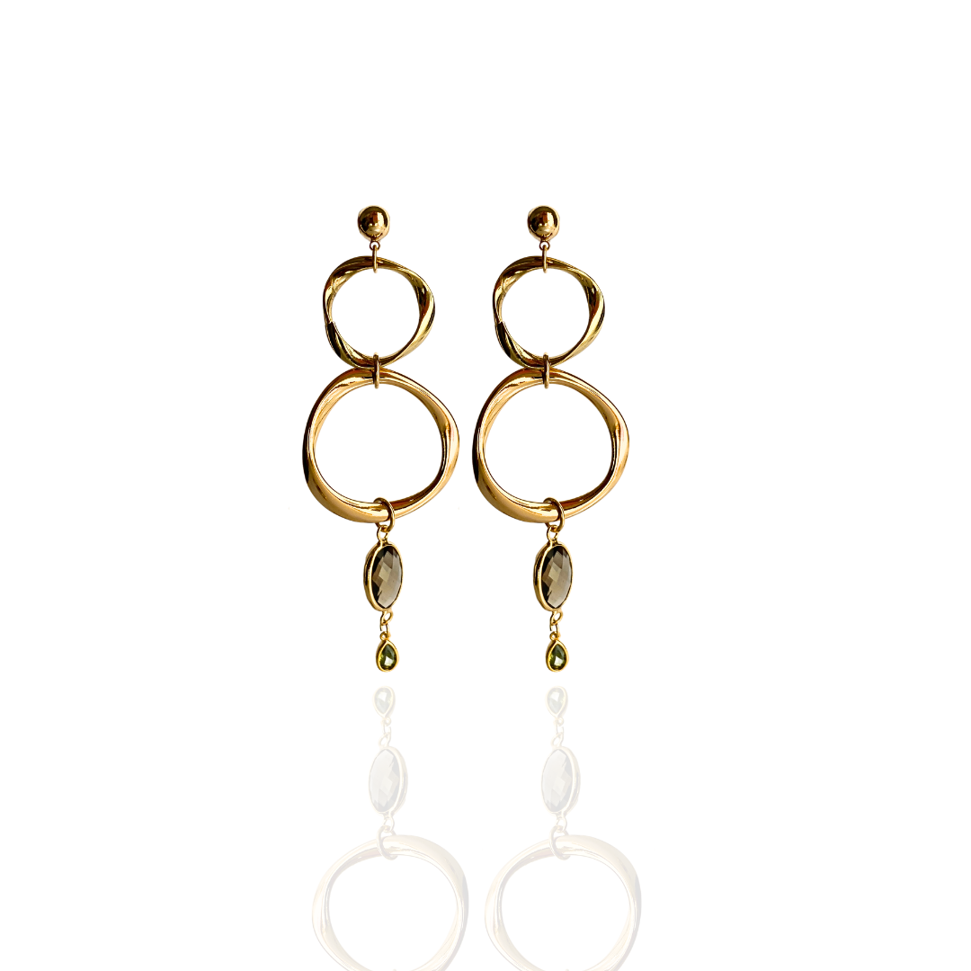 Close-up of gold dome earrings on model
Chunky hoop earrings for everyday looks
Bold gold statement earrings