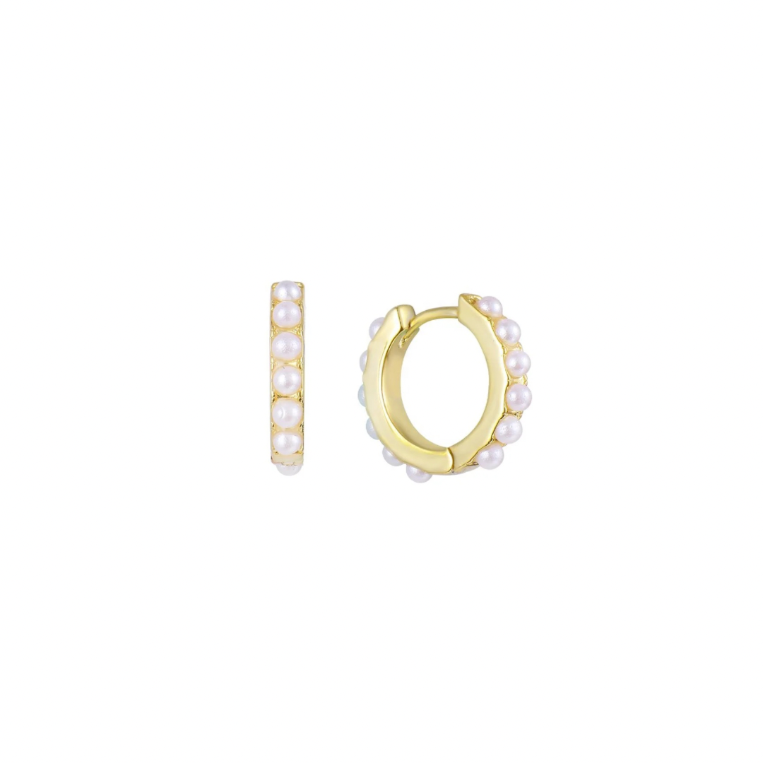 Add a touch of elegance with PEARL GOLDEN HUGGIES. The pearl details add a classic touch while the golden huggie design brings a modern spin. Perfect for any occasion, they'll be your go-to accessory.