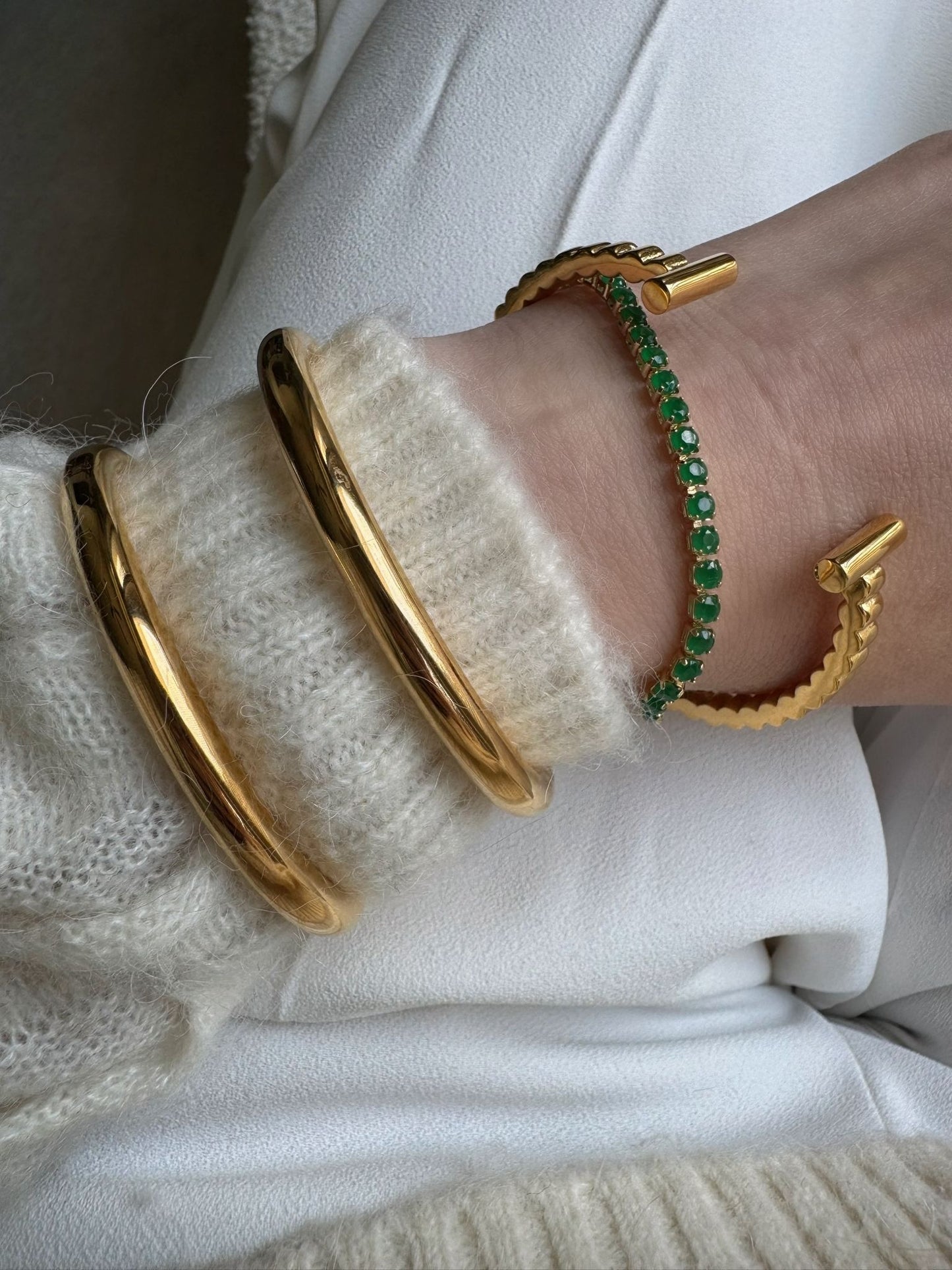 Sterling silver .925 + 18K gold plated. You get the look & feel of gold jewelry at a fraction of the price.