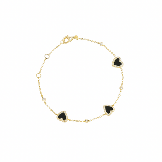 Add a touch of cuteness and elegance to your outfit with our HEART ONYX BRACELET! Made from gorgeous onyx, this bracelet features a charming heart design that will surely steal hearts (pun intended). Perfect for any occasion, this bracelet is a must-have for any jewelry collection.
Material: Sterling silver .925 + 18K gold plated
Measurements: 7.60 in