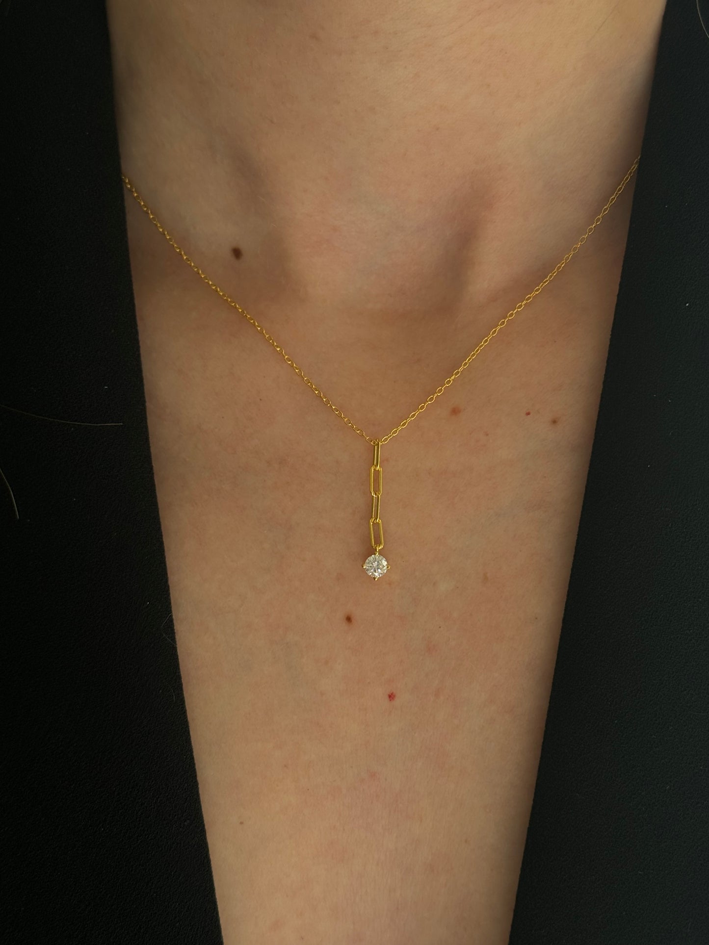Add a touch of sparkle to any outfit with our playful DROP SPARKLE NECKLACE.
Perfect for a night out or a playful addition to your everyday style, this necklace will catch the light and hearts of all who see it.
This perfectly sits right above the cleavage and we love this for one of the longer layers in your layered stack.
Material: 925 Sterling Silver + 18K gold plated
Measurements: 15.10 + 2.00 in