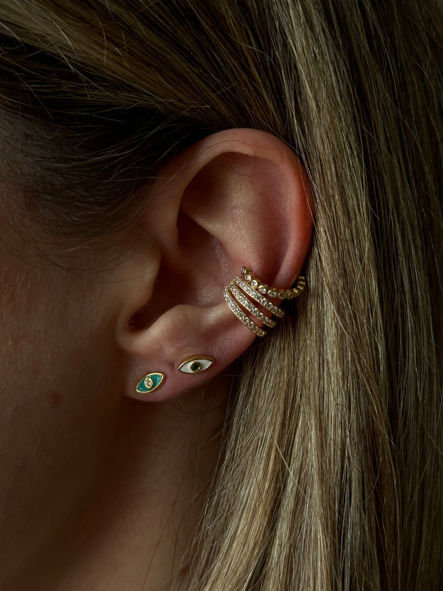 Protect yourself from negative energy and bring some edge to your look with our ENAMEL EVIL EYE BLUE STUDS!
These stylish studs are not only trendy, but they also serve as a powerful symbol of protection.
Add some attitude to your style and keep the bad vibes away with these eye-catching earrings.
Material: 925 Sterling Silver + gold plated 18K
Measurements: .3 in x .15 in
