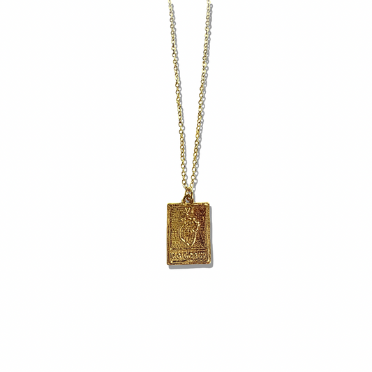Embrace the power of love and intuition with our El Corazón Tarot Necklace. Inspired by mystical tarot symbolism, this gold-plated pendant features an intricately detailed heart, representing passion, strength, and emotional clarity. Whether you wear it as a spiritual amulet or a bold fashion statement, this piece is perfect for layering or wearing solo.