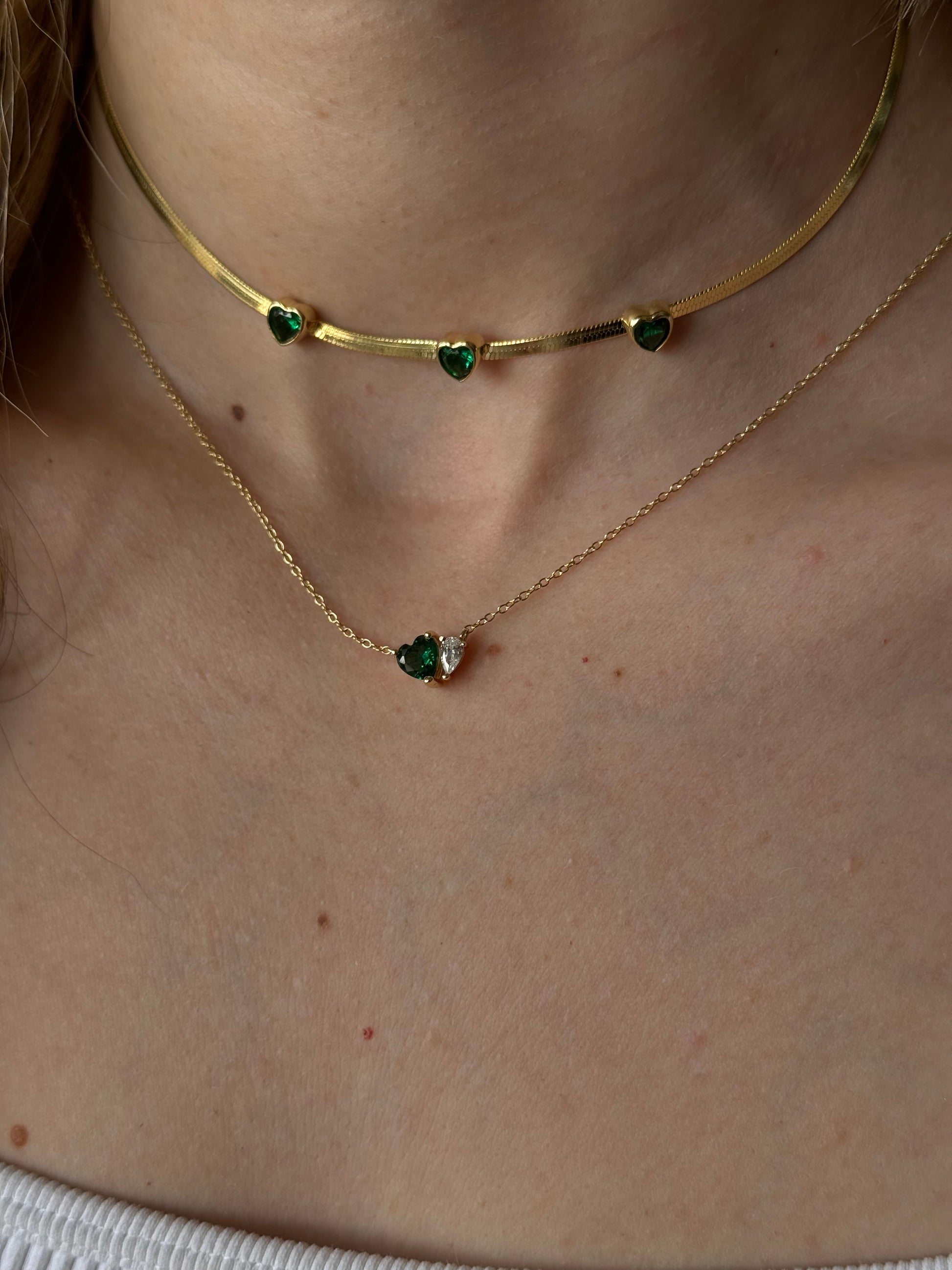 Perfect Valentine's Day Gift for her. Slither your way into someone's heart with our Emerald Heart Snake Necklace! This stunning piece features a charming snake design with a sparkling emerald heart at the center. A unique and playful addition to any jewelry collection. (Warning: may cause extreme envy from friends)
 
Material: Sterling silver .925 + 18K gold plated
Measuerments: 1.8 x 1.6 cm