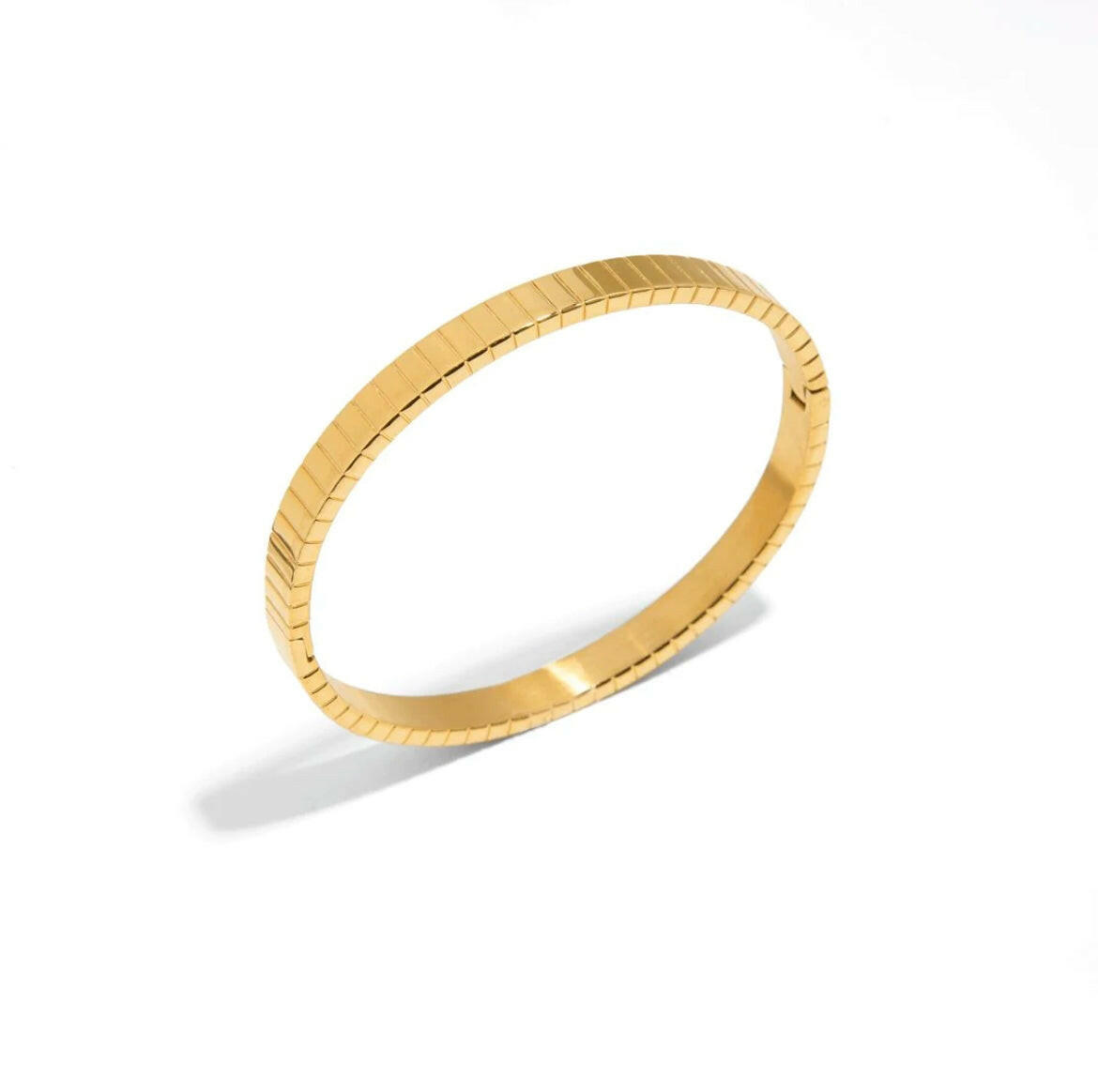 This line gold bracelet is expertly crafted with high-quality materials for a sleek and sophisticated look. The minimalist design adds a touch of elegance to any outfit. Made with precision and attention to detail, this bracelet is the perfect accessory for any occasion.
Material: 100% brass 18k gold plated
Measurements : 2.20 x 2.50 in