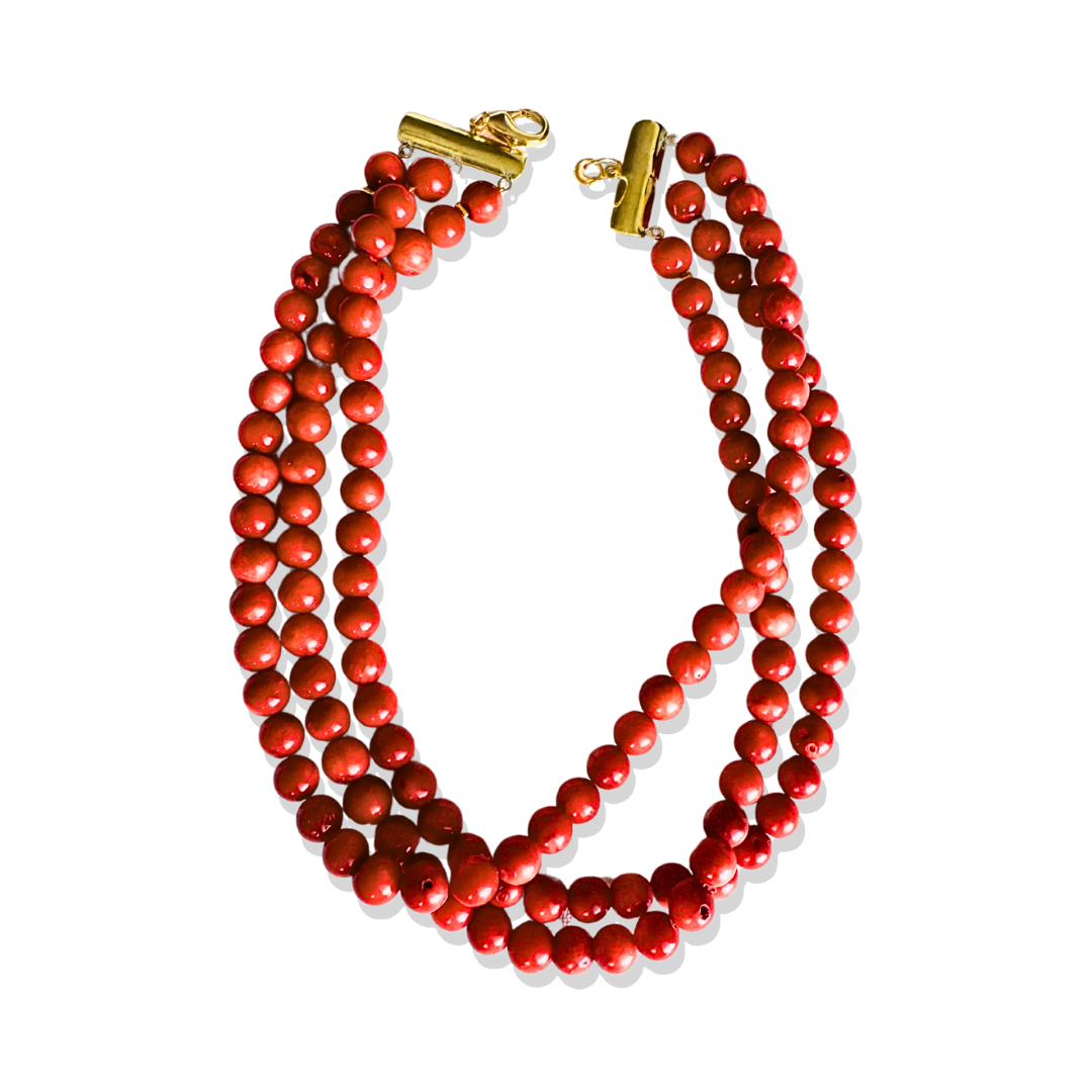 Gold Coral Charm Necklace on white background with natural coral beard.