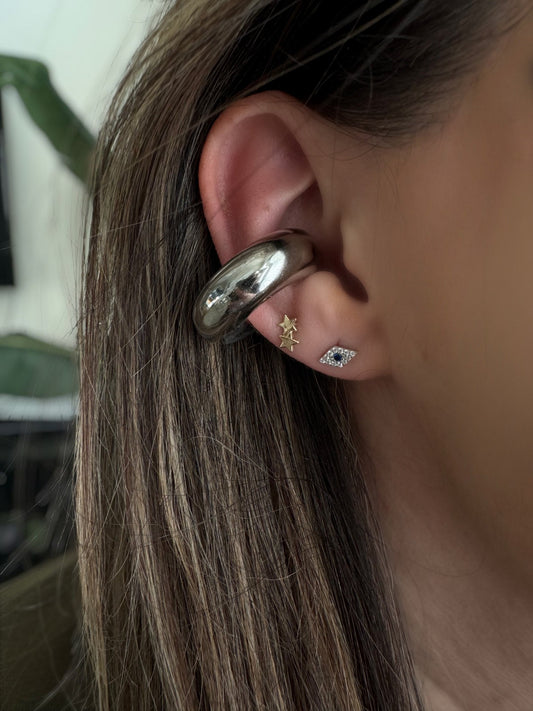 Chunky silver ear cuff worn on ear