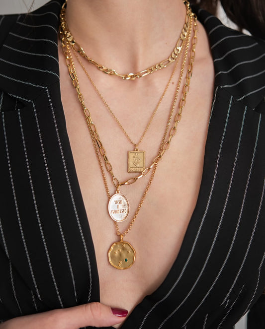 Manifestation Jewelry
Step into your power with the “Tu Sei il Manifesto” gold pendant necklace, a bold affirmation that translates to “You Are the Manifestation” in Italian. Designed for those who believe in self-empowerment and intentional living, this engraved gold medallion necklace serves as a daily reminder that you are the creator of your reality. Crafted with 18k gold plating, this meaningful affirmation necklace is perfect for layering with other spiritual and manifestation jewelry