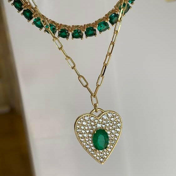 Add a touch of love to your look with our EMERALD HEART FIGARO NECKLACE.
This stunning necklace features a delicate figaro chain and a heart-shaped emerald pendant that adds a touch of whimsy to any outfit.
Perfect for adding a pop of color and charm to your look. Wear it alone or layer it with other pieces for a unique and playful look.
Material: Sterling silver .925 + 18K gold plated
Measurements: 17 in + 1.10 in pendant : .80 x .70 in