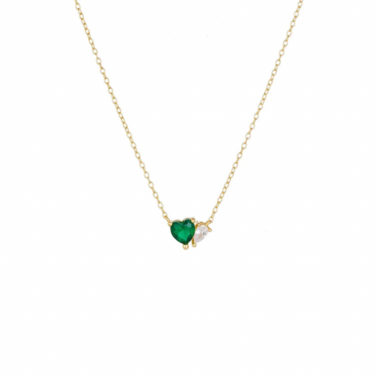 This green heart necklace necklace features a beautiful green heart pendant, symbolizing love and growth.

Show your loved one or a friend how much they mean to you with this heartfelt gift or treat for yourself.

Material: 925 Sterling Silver + gold plated 18K 

Measurements: 15.8 in + 2.2 in pendant: .40 x .30 in