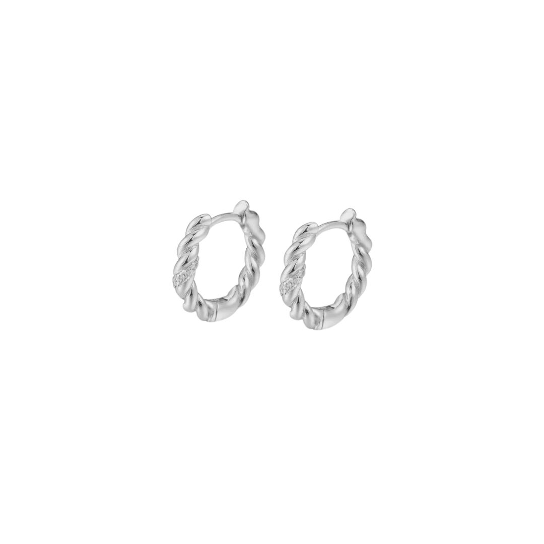 Add a touch of sparkle to your everyday look with our TWISTED SPARKLE SILVER HOOPS. These elegant hoops feature a unique twist design that catches the light and adds a glamorous touch to any outfit. Made of high-quality silver, they are both stylish and durable. Elevate your style with these stunning hoops!

Material: .925 Sterling Silver + 14K gold plated

Measurements: .55 in diameter