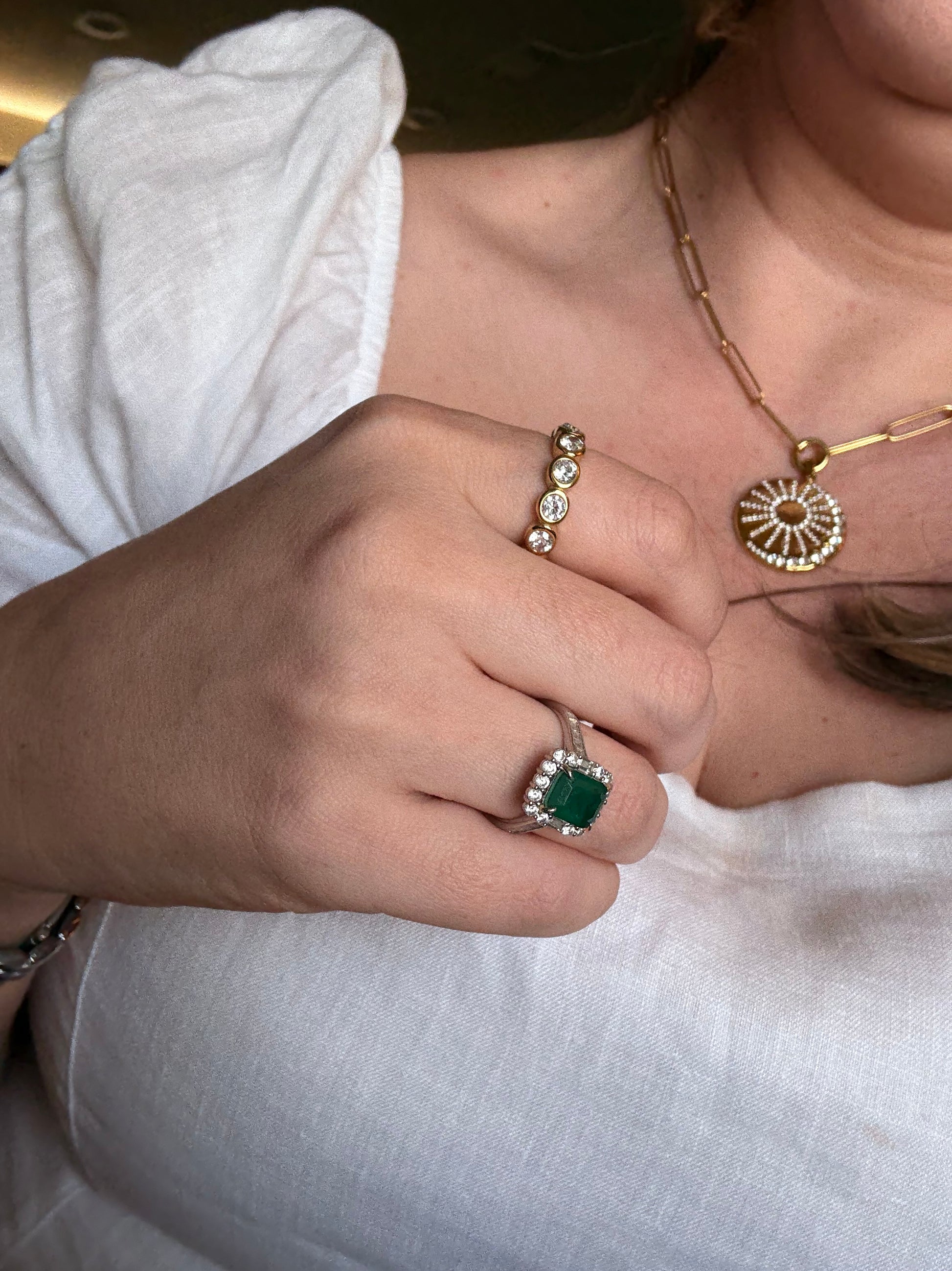 Solara sun and moon coin pendant necklace detail, pave crystal sun