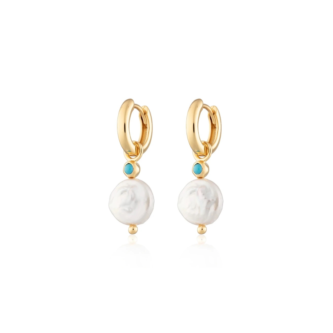 Baby Blue Pearl Hoops are gracefully designed earrings with small hoops, showcasing a charming baby blue color. The hoops are adorned with lustrous pearls, adding a touch of elegance to this delightful accessory. Perfect for both casual and formal occasions, these earrings effortlessly combine sophistication with a subtle pop of color.

Material: 925 Sterling Silver + gold plated 18K

Measurments: 5.3 x 21.3mm

 