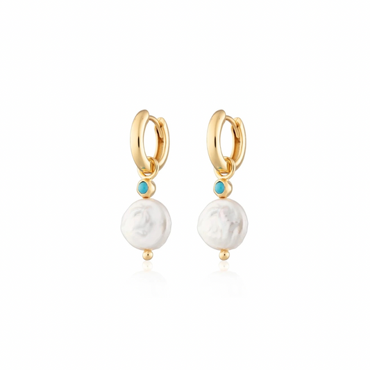 Baby Blue Pearl Hoops are gracefully designed earrings with small hoops, showcasing a charming baby blue color. The hoops are adorned with lustrous pearls, adding a touch of elegance to this delightful accessory. Perfect for both casual and formal occasions, these earrings effortlessly combine sophistication with a subtle pop of color.

Material: 925 Sterling Silver + gold plated 18K

Measurments: 5.3 x 21.3mm

 