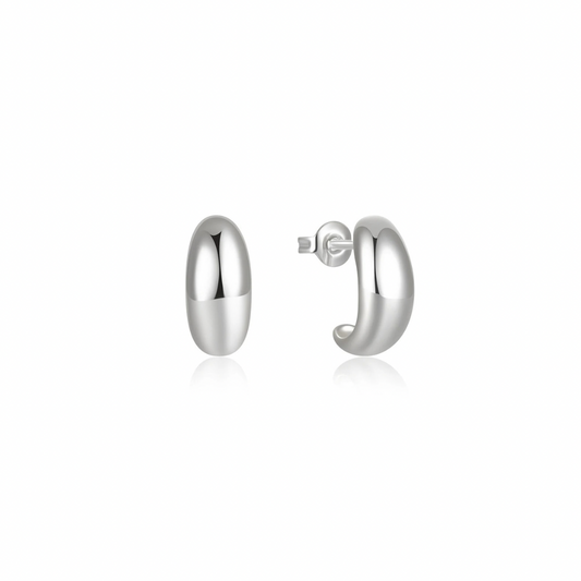 Step into trendsetting style with our Silver Luly Studs. These sleek studs add a touch of playful charm to any outfit.
Don't miss out on the trend of 2024!
Material: .925 Sterling Silver + 18K gold plated
measurements: .40 x .55 in