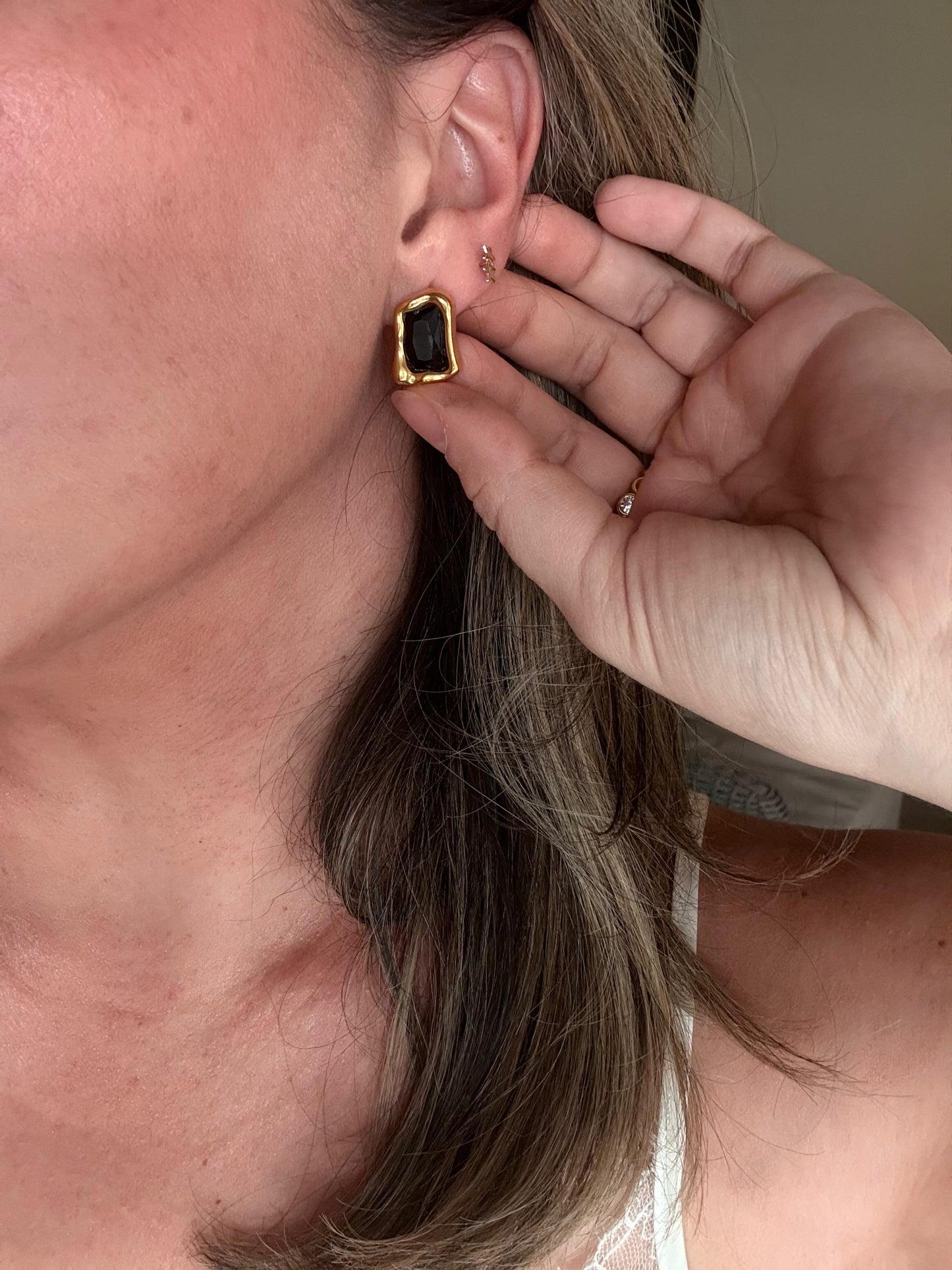 Verona black onyx studs worn on ear
