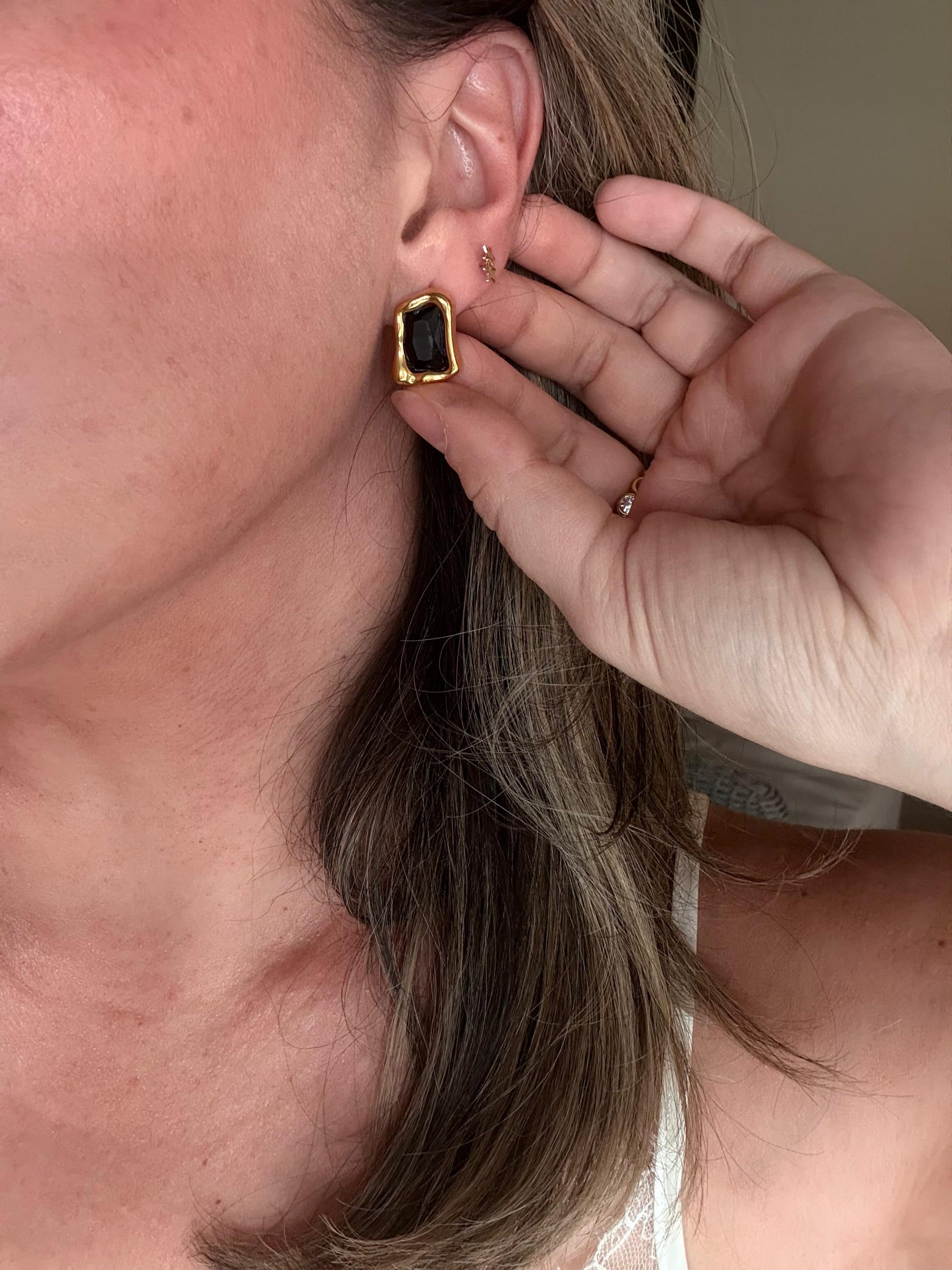 Verona black onyx studs worn on ear