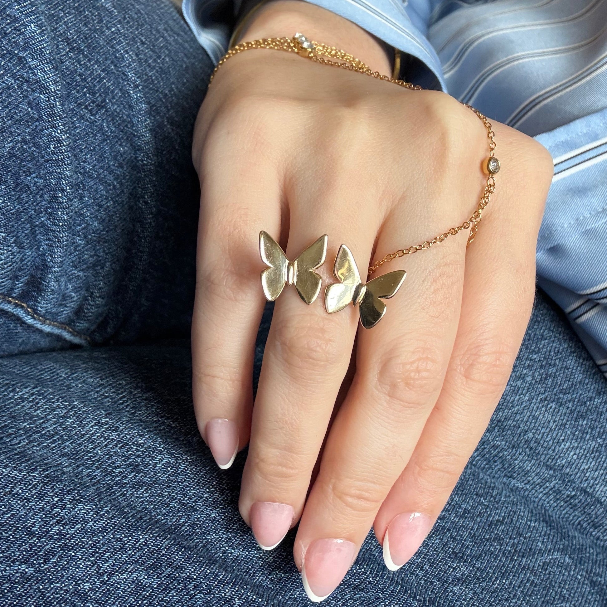 Double butterfly gold ring lifestyle shot
