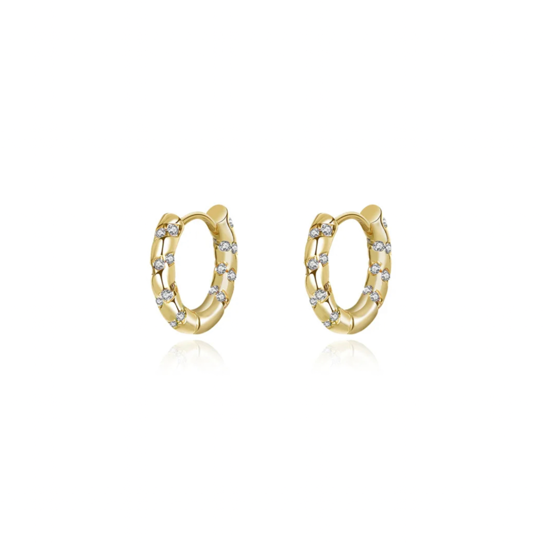 These gold hoops have a unique twist with their caramel-colored transparent design. Perfect for adding a touch of fun to any outfit. (No calories, we promise!)