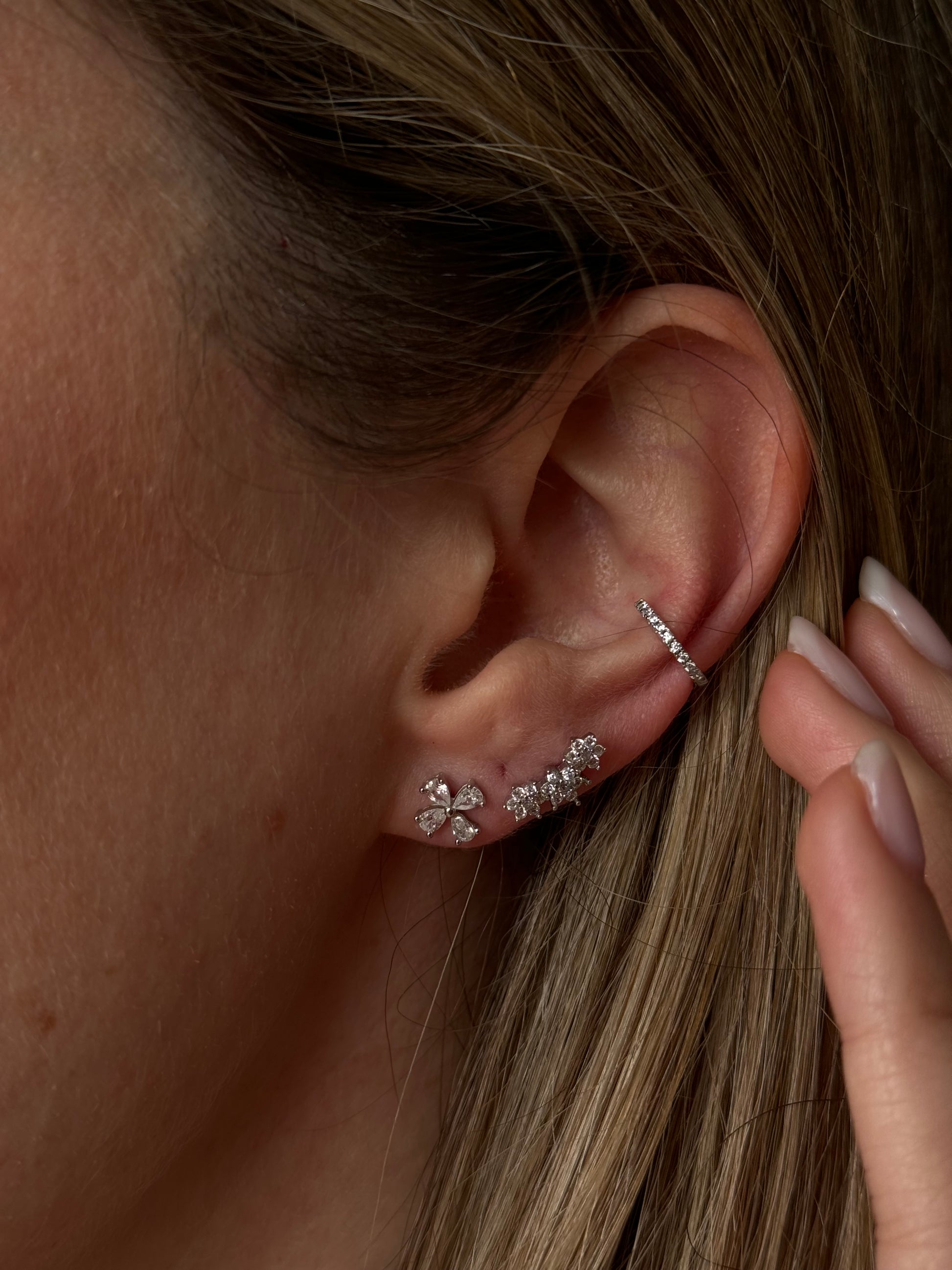 Take your style to the next level with the Triple Silver Flower Studs! This unique accessory will add a touch of whimsy to any outfit. Don't just bloom, triple bloom with this playful and versatile silver flower! 

Material: .925 Sterling Silver + 18K gold plated

Measurements: .45 x .20 in 