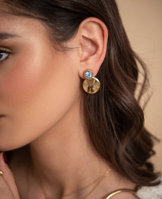 Nerea baby blue large earrings worn on ear