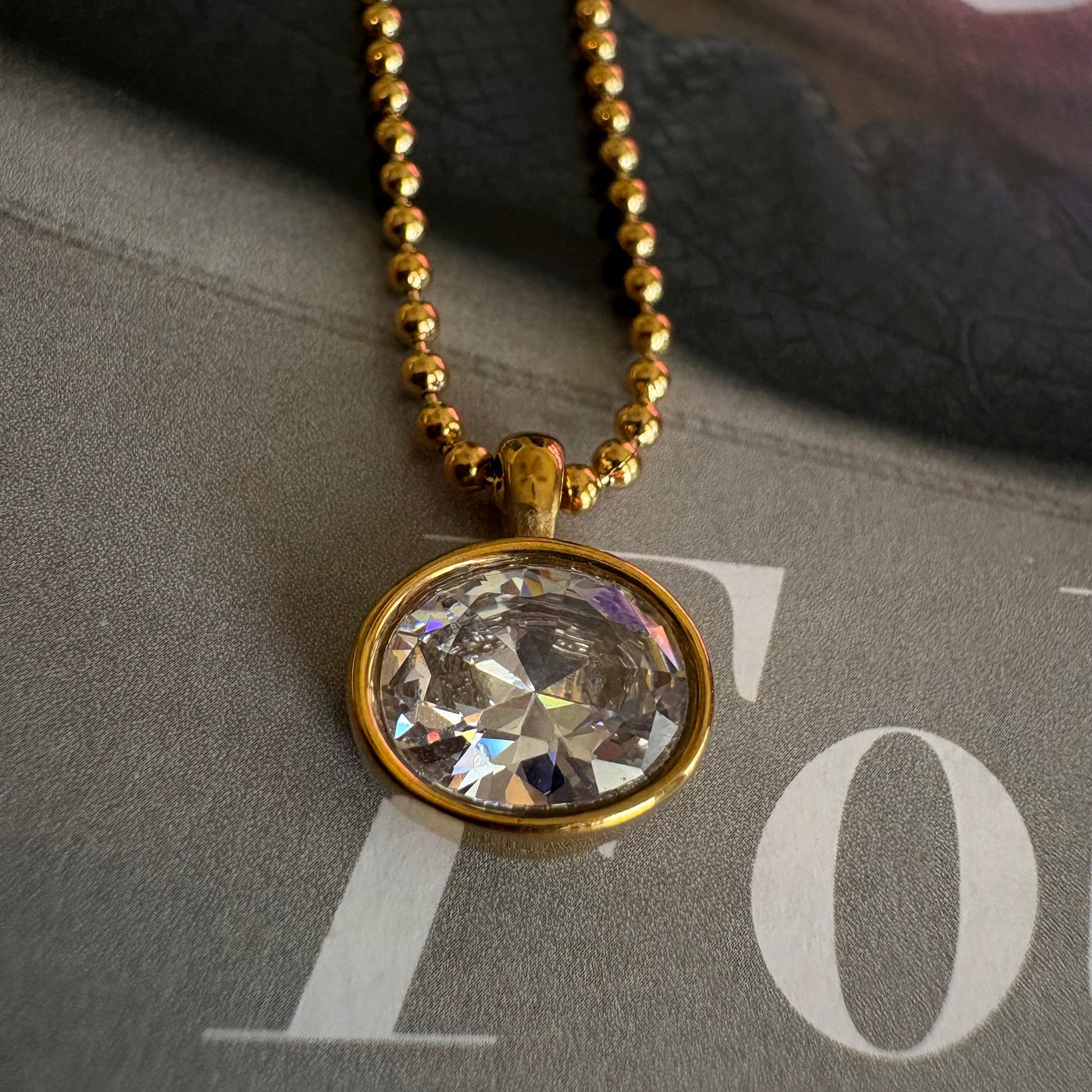 Charlotte oval ball chain necklace worn on neck