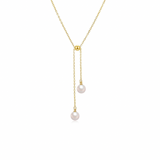 Double the pearls, double the elegance! This delicate golden necklace will add a touch of sophistication to any outfit. A timeless piece that will never go out of style. Perfect for any occasion, this necklace is a must-have for any jewelry collection.
Material: .925 Sterling Silver + 18K gold plated
Measurements: 15.60 + 2.00 in + chain and pearls length: 2.15 in