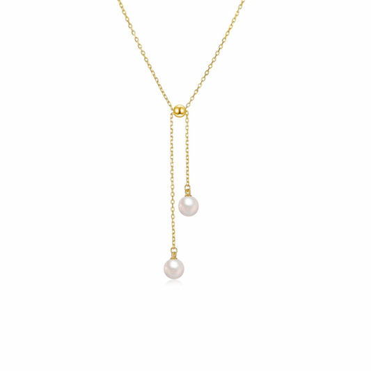 Double the pearls, double the elegance! This delicate golden necklace will add a touch of sophistication to any outfit. A timeless piece that will never go out of style. Perfect for any occasion, this necklace is a must-have for any jewelry collection.


Material: .925 Sterling Silver + 18K gold plated
Measurements: 15.60 + 2.00 in + chain and pearls length: 2.15 in