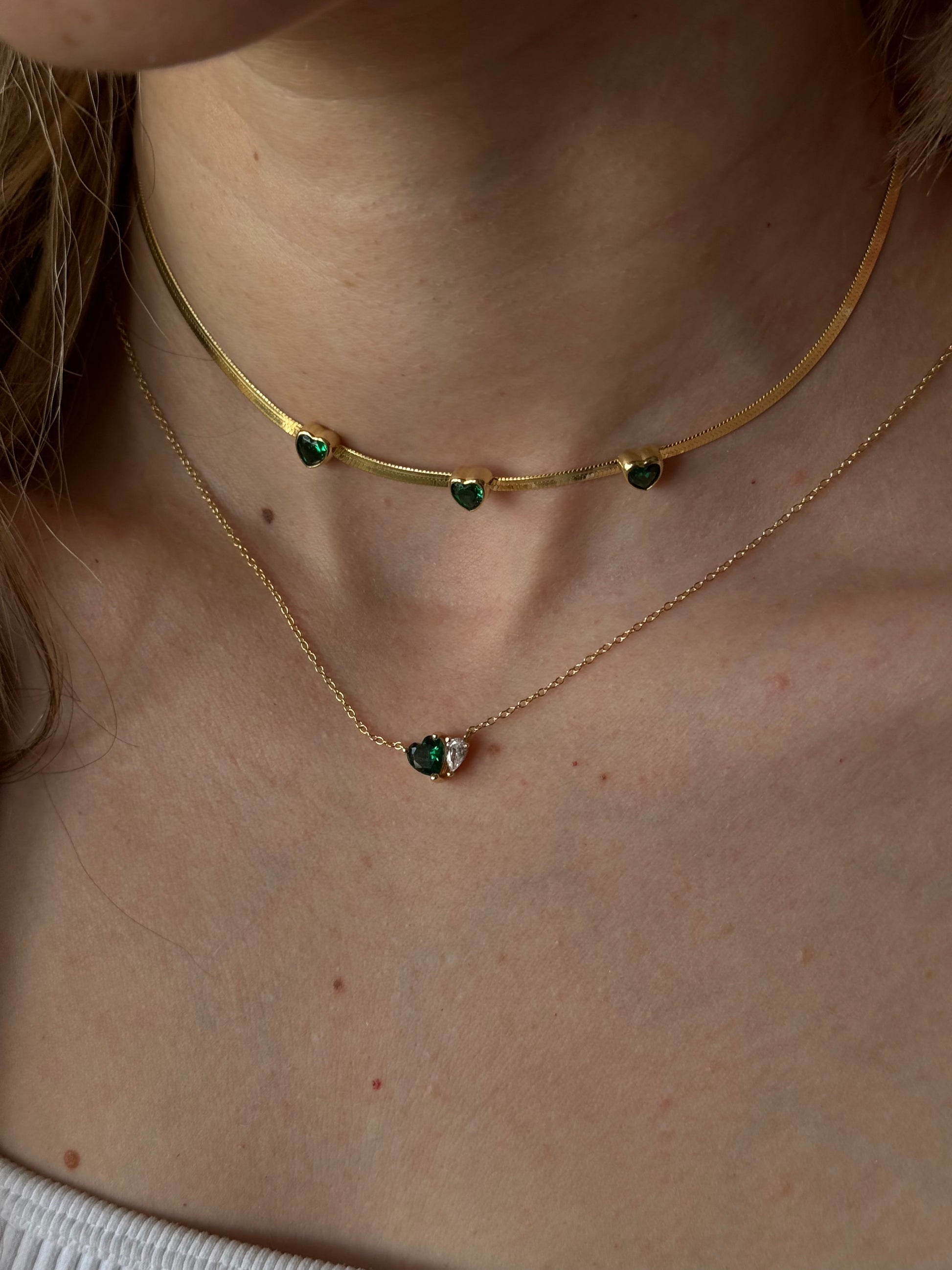 This green heart necklace necklace features a beautiful green heart pendant, symbolizing love and growth.

Show your loved one or a friend how much they mean to you with this heartfelt gift or treat for yourself.

Material: 925 Sterling Silver + gold plated 18K 

Measurements: 15.8 in + 2.2 in pendant: .40 x .30 in