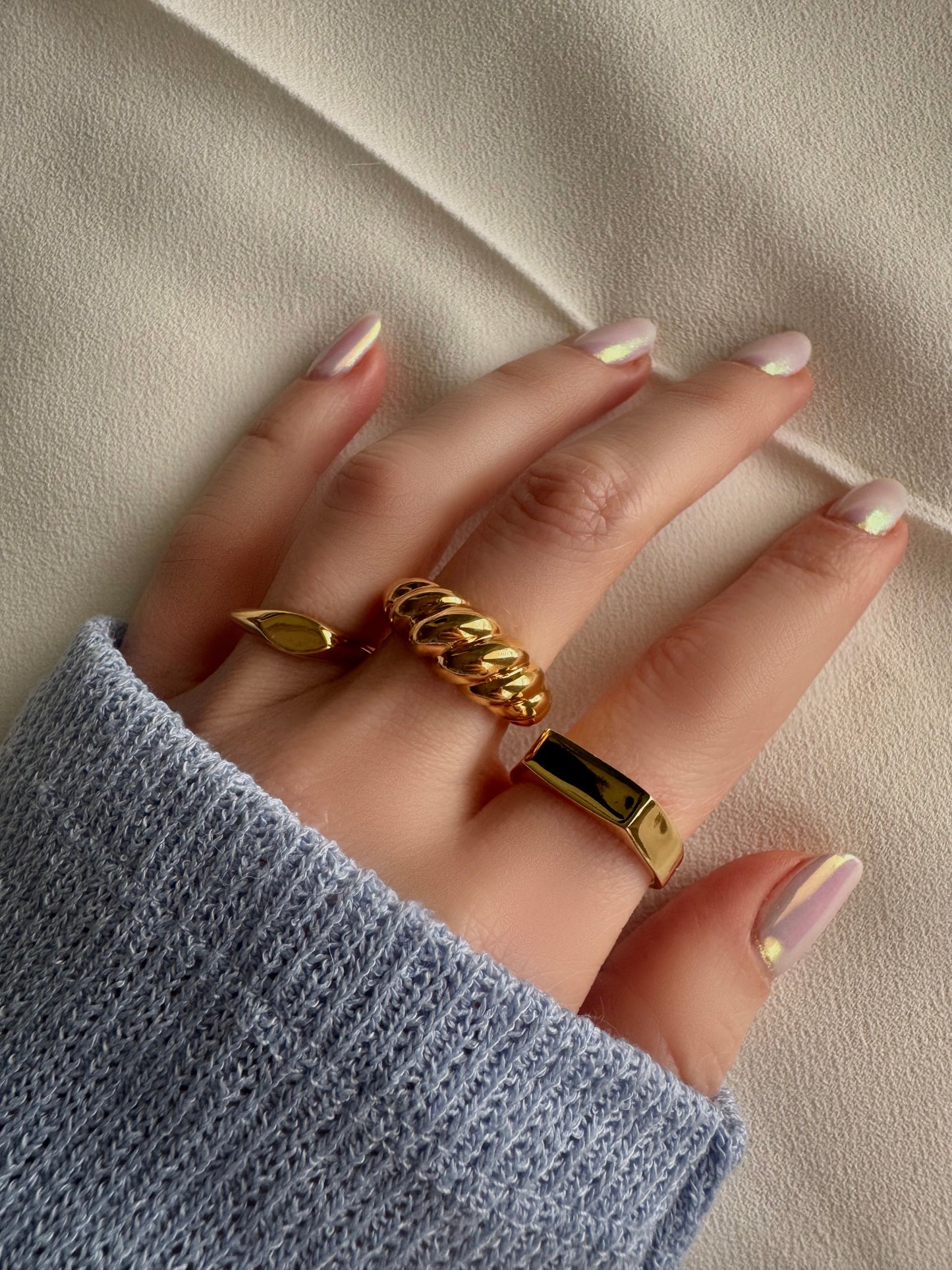 The perfect blend of chic and bold, our Croissant Ring is the ultimate must-have for your collection. Inspired by Parisian elegance, this gold twisted ring features a unique, handcrafted design in stainless steel with a thick layer of 18K gold for that luxe touch. Perfect to wear alone or stacked, its chunky yet refined silhouette adds effortless sophistication to any look. Whether you're keeping it minimal or mixing it up for an edgy vibe, this ring is fabulous. Bon appétit, fashion lover.