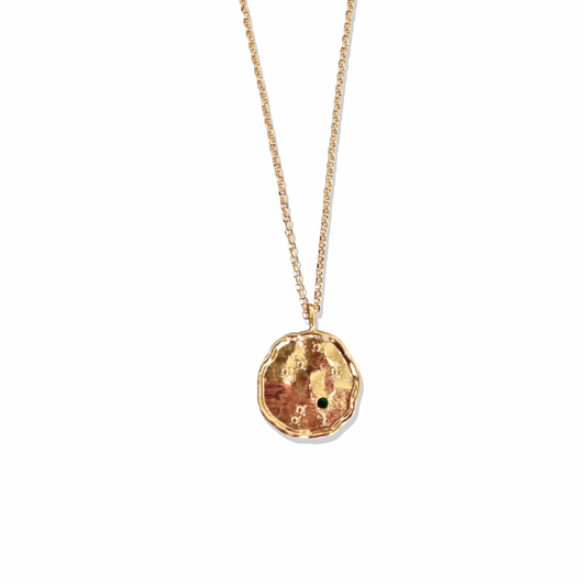 Elevate your jewelry collection with this stunning Constellation gold coin necklace, featuring a beautifully textured constellation-inspired pendant. Adorned with a delicate green gemstone accent, this zodiac star map necklace is perfect for those who love astrology jewelry and cosmic symbolism. Whether styled alone or layered with other trendy gold necklaces, this boho-chic statement piece adds a touch of luxury and mystique to any outfit.