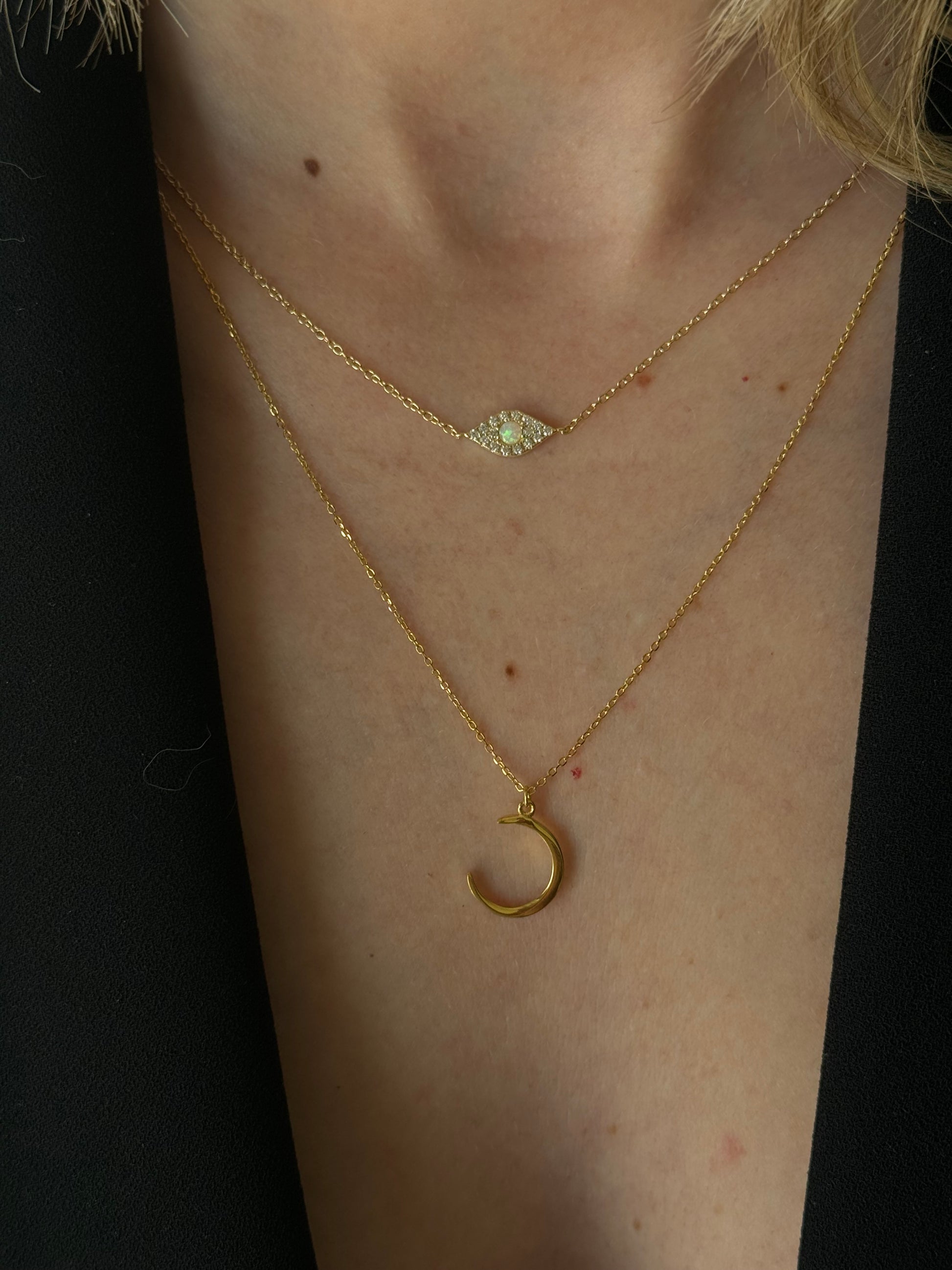 Elevate your daily affirmations with our Skinny Moon Golden Necklace. 

✨“I embrace growth, welcoming new opportunities that come my way.” ✨

This delicate piece is crafted in .925 Sterling Silver + gold plated 18K and features a slender moon pendant, reminding you to stay connected to your inner peace and confidence.
This perfectly sits right above the cleavage and we love this for one of the longer layers in your layered stack.