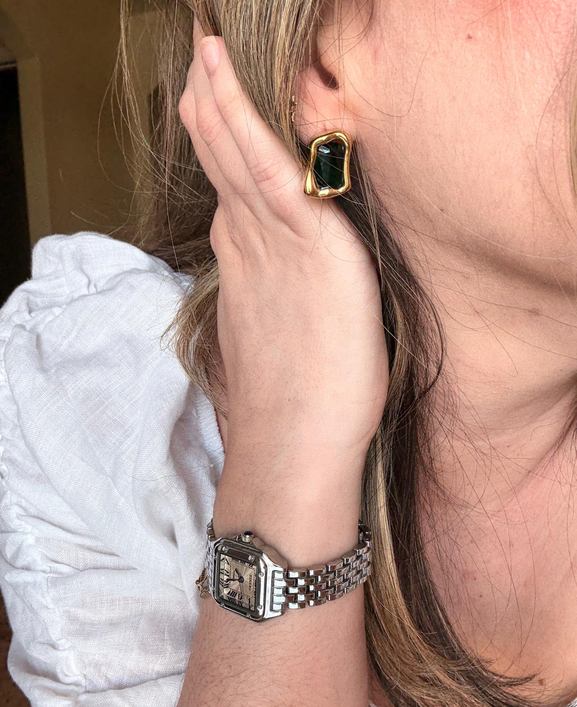 Verona emerald green studs worn on ear