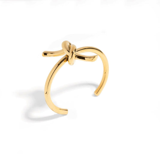 Elevate your style with our SOULMATE BRACELET. This cuff bracelet features a symbolic knot design. With its elegant and timeless appeal, it will effortlessly complement any outfit, making it an essential piece for every fashion-forward individual.

Elevate your look and embody the bond of true love with our SOULMATE  BRACELET.


Material: 100% Brass  and 18K gold plated

Measurements: 2.40 x 2.50 in

 