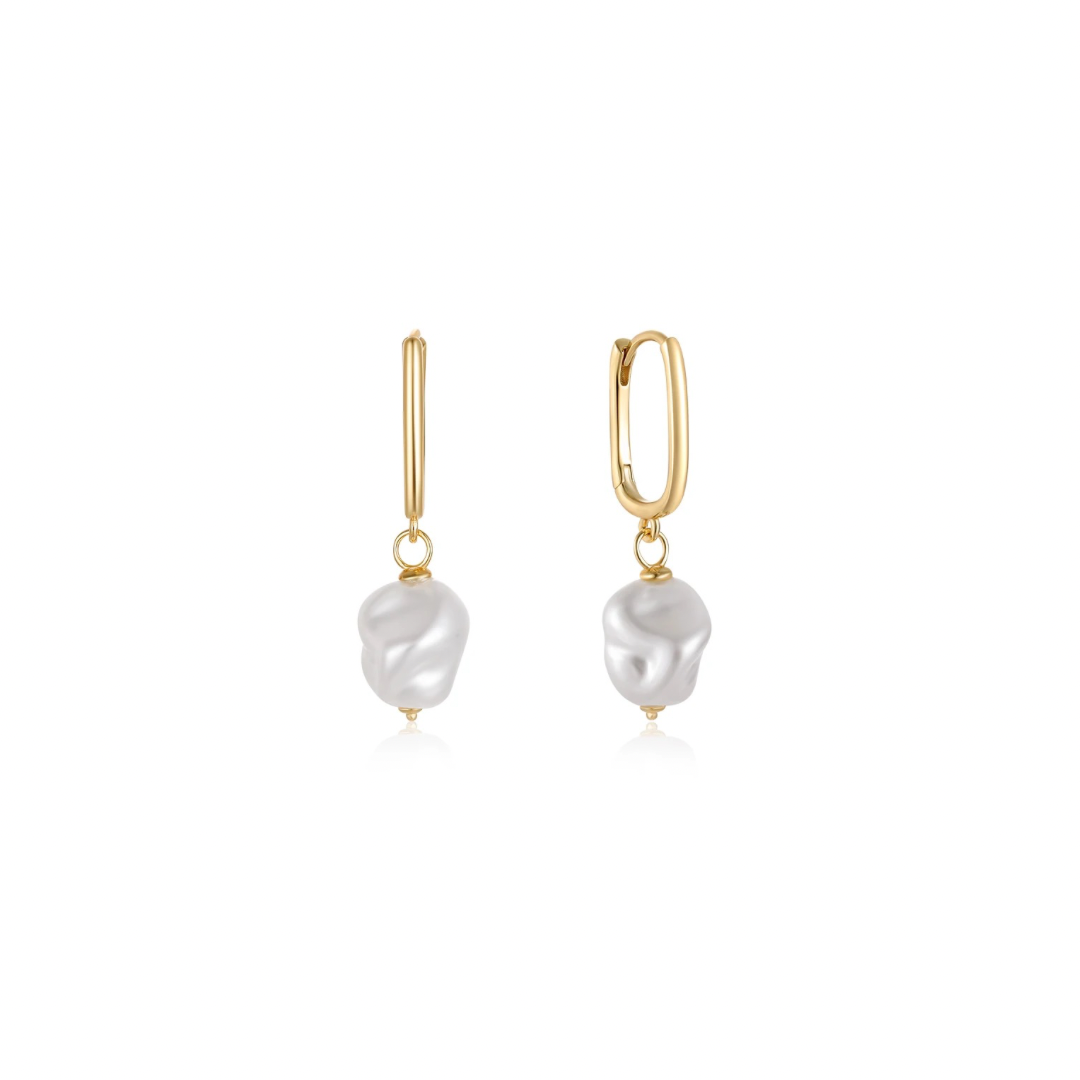 Elevate your style with these OVAL PEARL GOLDEN HOOPS.  Perfect for day or night, these hoops are sure to make a nice statement and elevate your fashion game.  Make a bold statement with our trendy 2024 hoops!