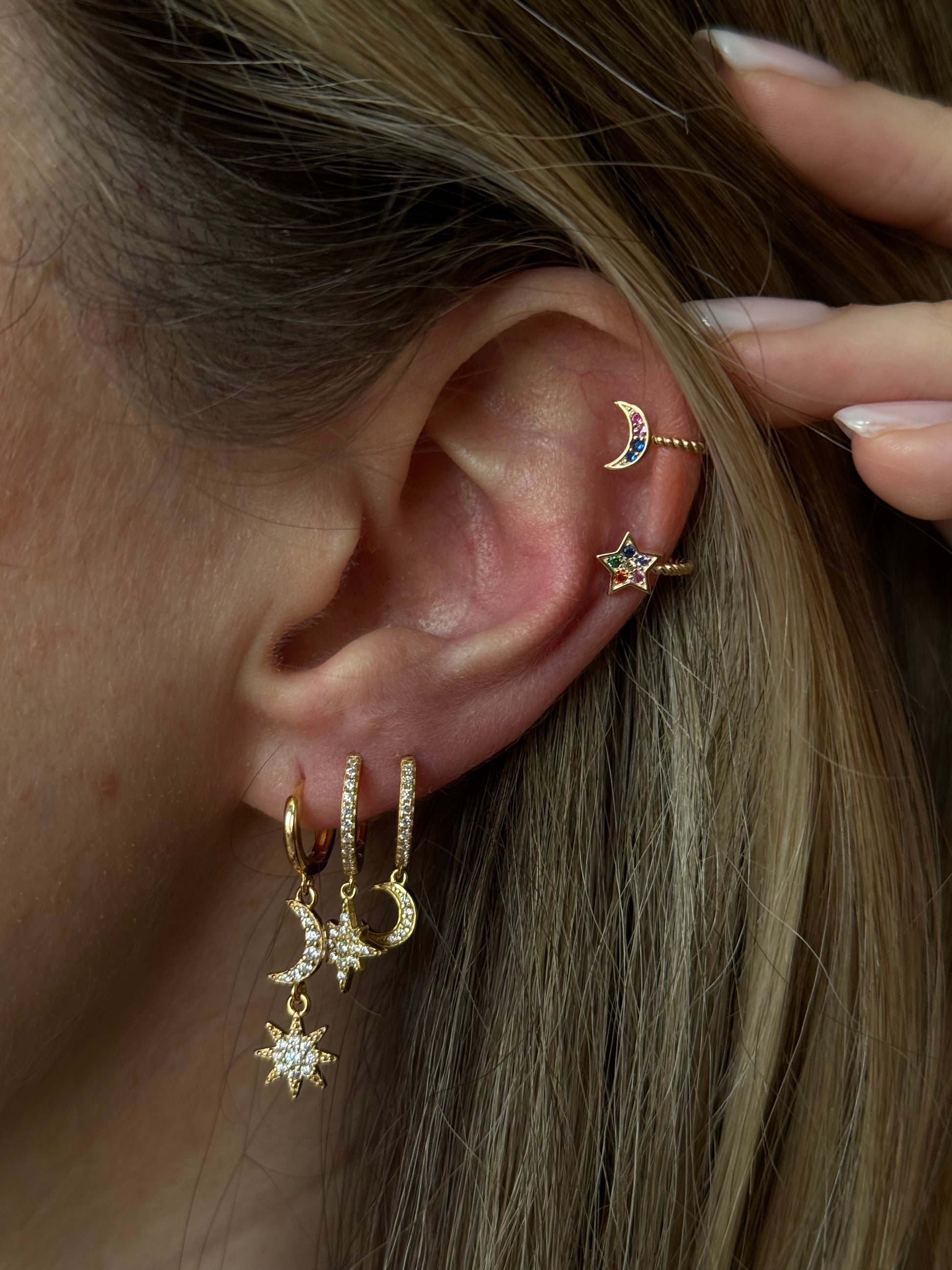 Add a touch of celestial charm to your outfit with our Moon and Star Drop Earrings. These earrings feature delicate moon and star charms, perfect for any stargazer or dreamer. Crafted with high-quality materials, these earrings are both stylish and durable. Elevate your look with these versatile and unique earrings.</p> <p><strong><br>Material:</strong> Sterling silver .925 + 18K gold plated Measurements: 1.15 x .40 in