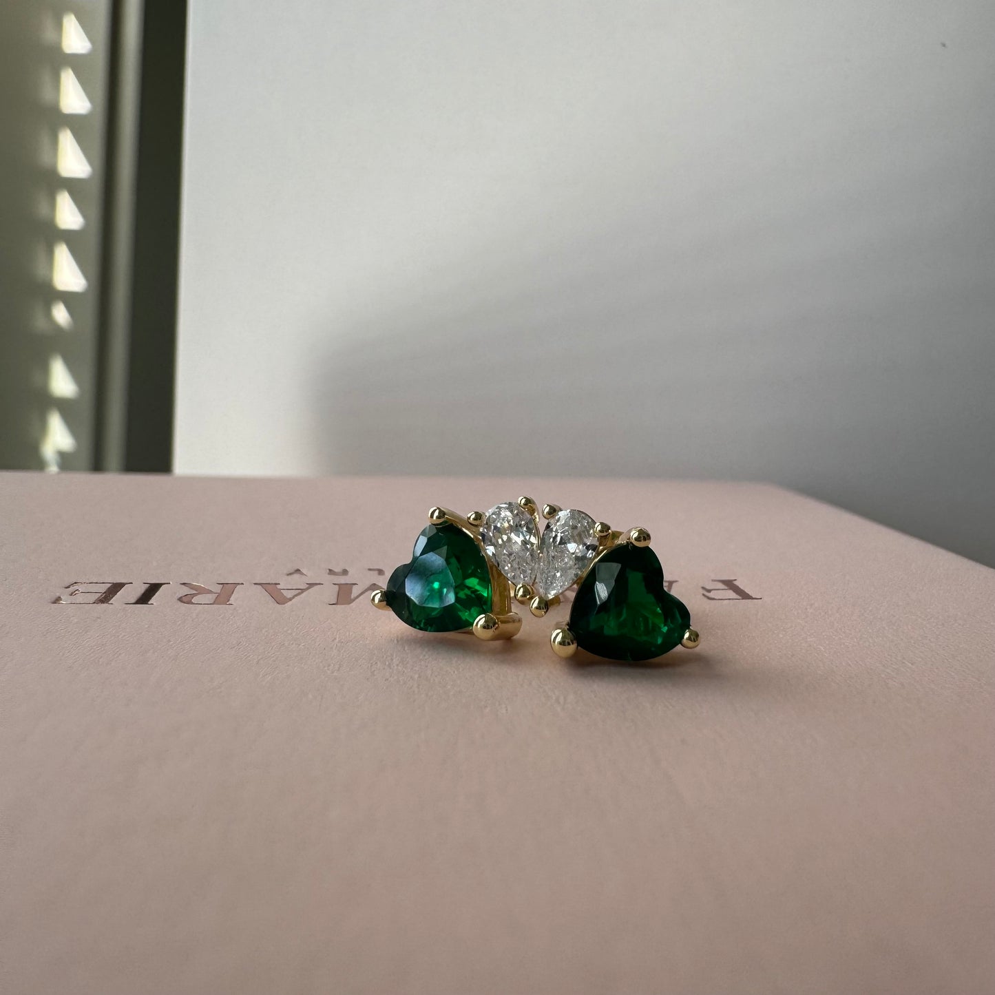 Indulge in the luxury of our GREEN HEART SPARKLE STUDS.

Exquisitely crafted with stunning green hearts, these studs add a touch  to any outfit.

Sparkling with every movement, they make a perfect gift for your loved one or a luxurious treat for yourself.


Material: 925 Sterling Silver + gold plated 18K

Measurements: .40x .30 in