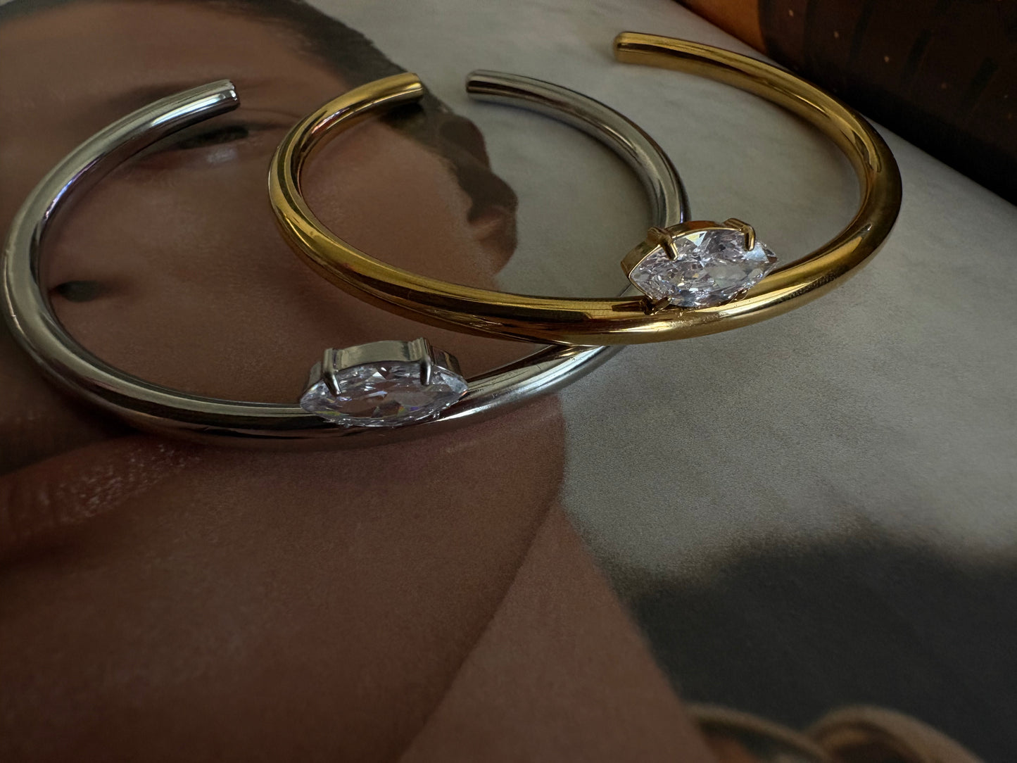 Luna gold marquise cuff bracelet worn on wrist, side angle