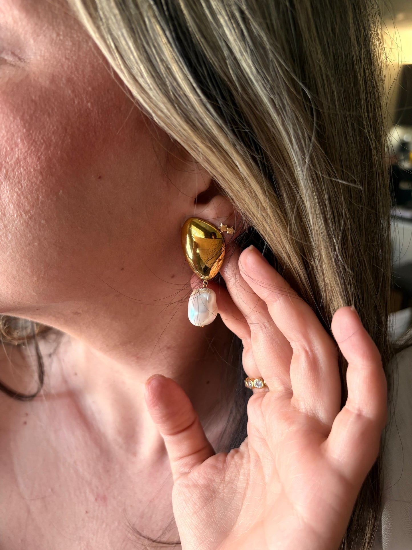Sienna baroque pearl drop earrings worn on ear
